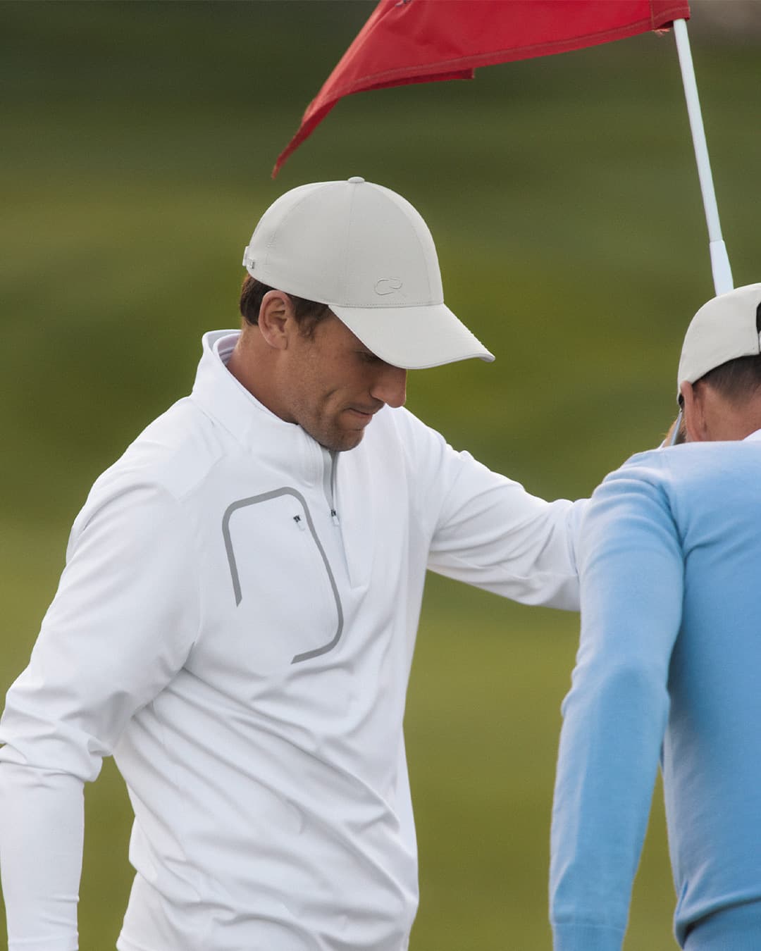 Side view of Casper Ruud on the Golf Course wearing the Off Court cap from varsity Headwear