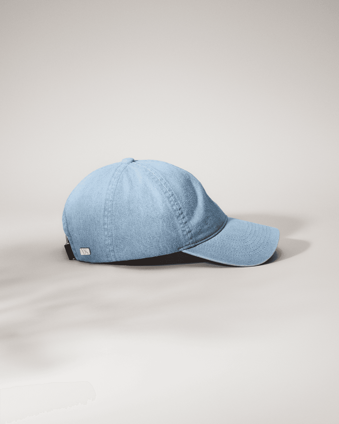 Front view of soft denim caps in faded blue