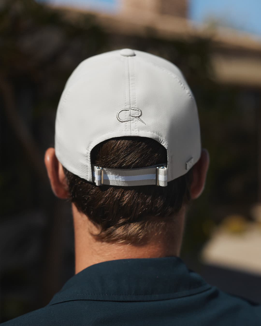Back view of details on Casper Ruud x Varsity headwear cap in beige
