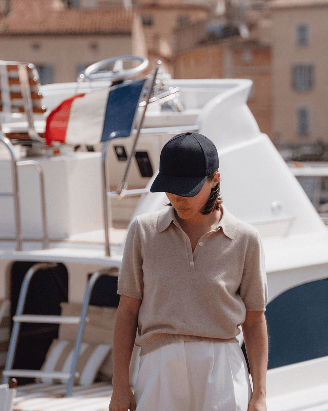 Front view of female in the french riviera wearing black linen cap