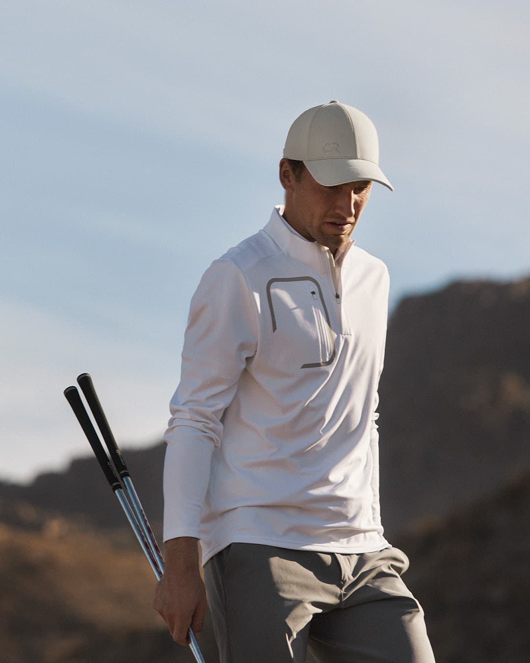 Side view of Casper Ruud on the Golf Course wearing the Off Court cap from varsity Headwear