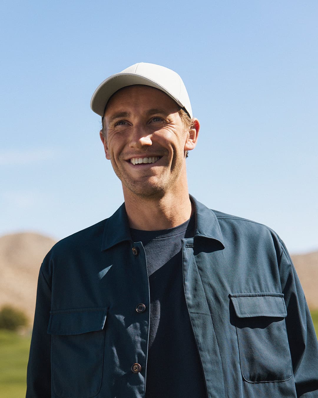 Side view of Casper Ruud on the Golf Course wearing the Off Court cap from varsity Headwear