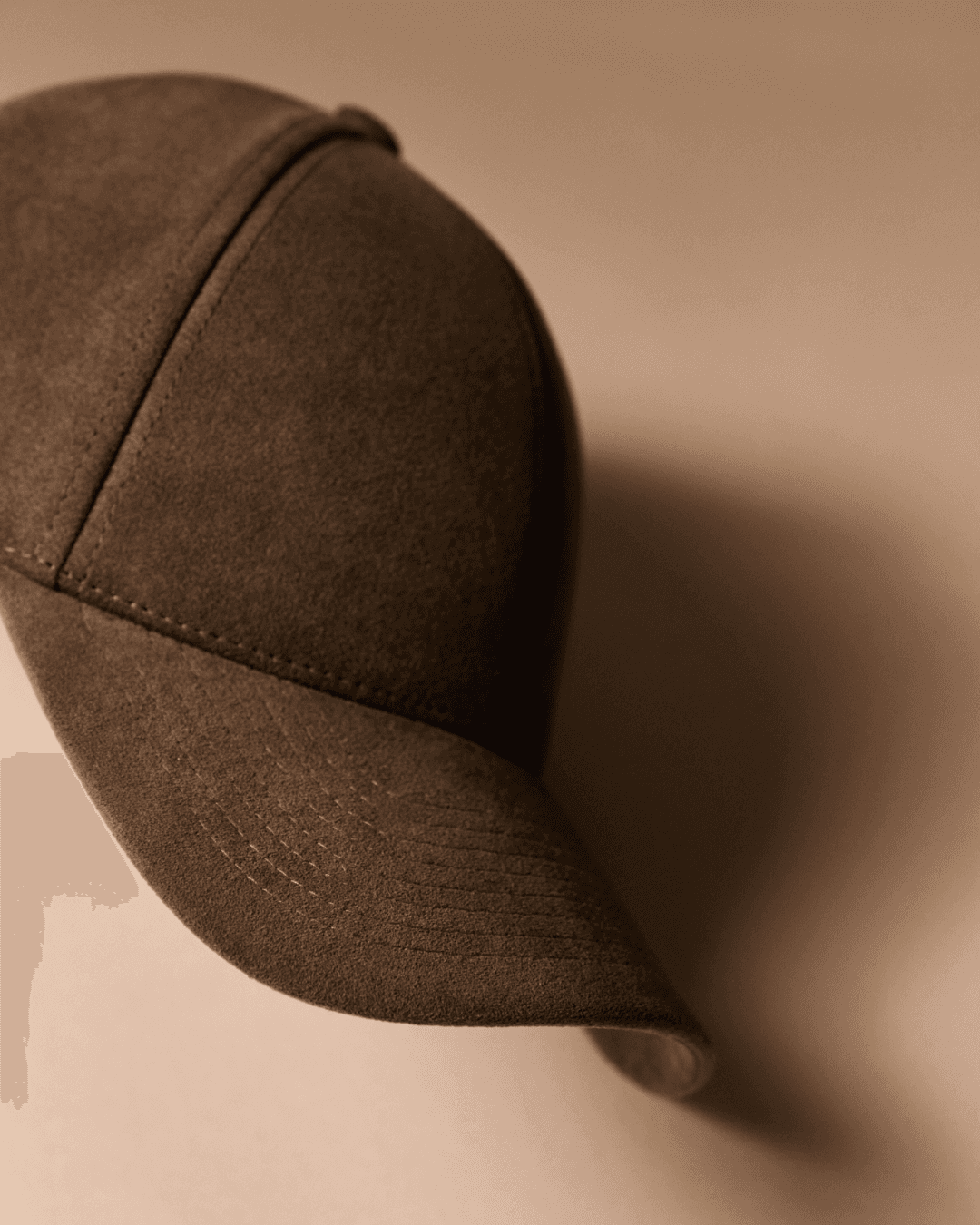 Side view studio image of Macchiato Brown Alcantara cap