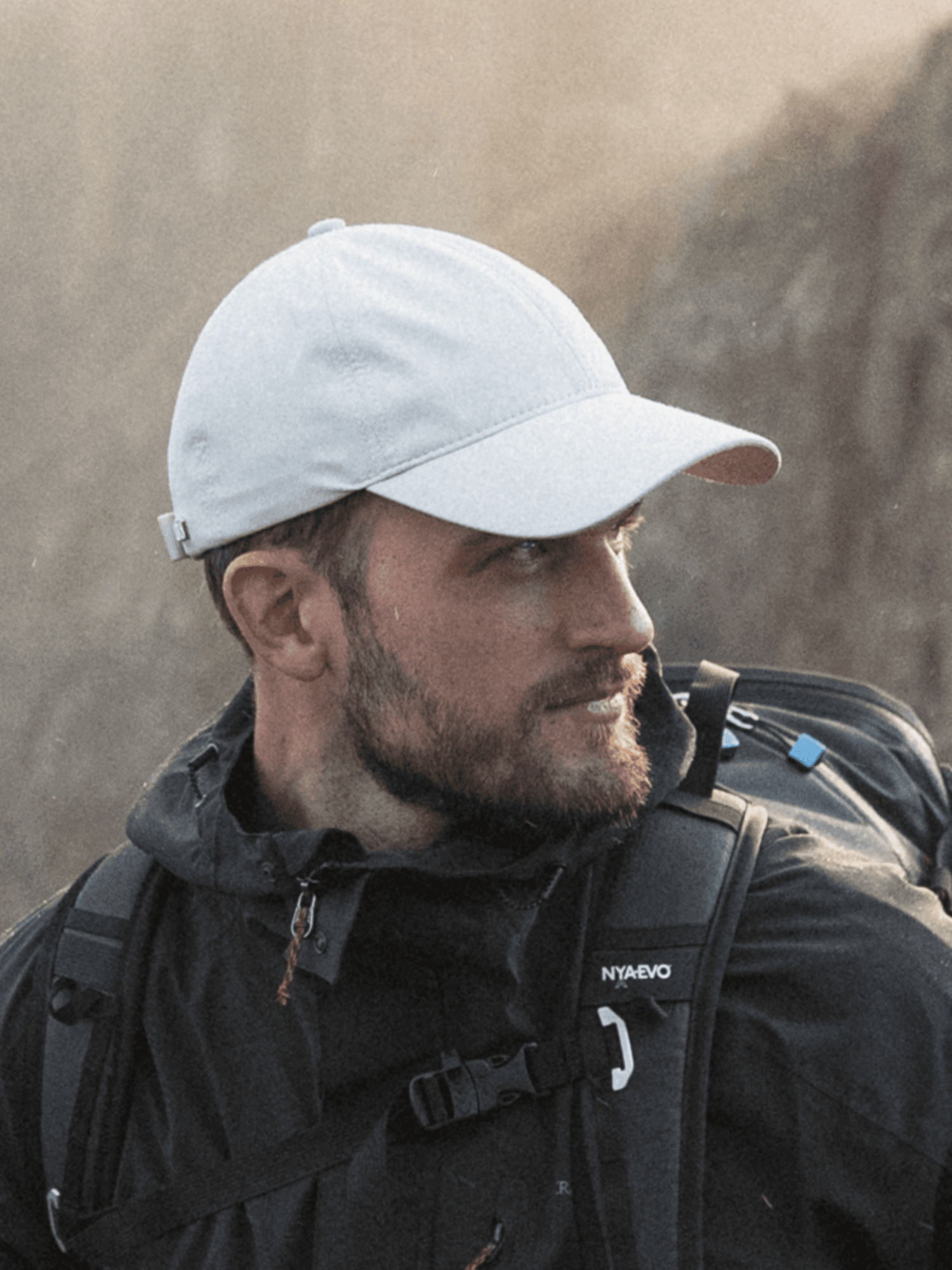 Side view of a white legacy soft active tech sports cap from Varsity headwear