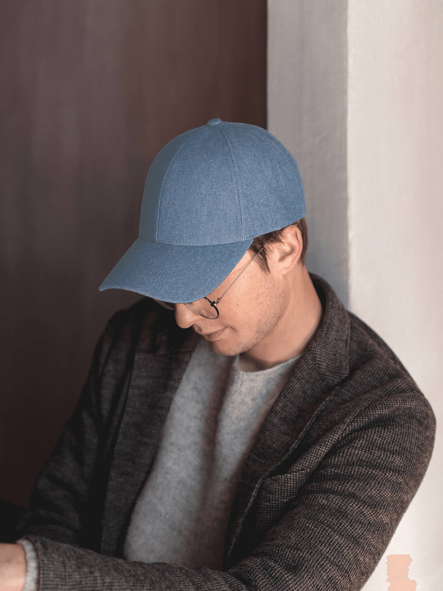 Side view of a male model wearing a legacy structured denim cap