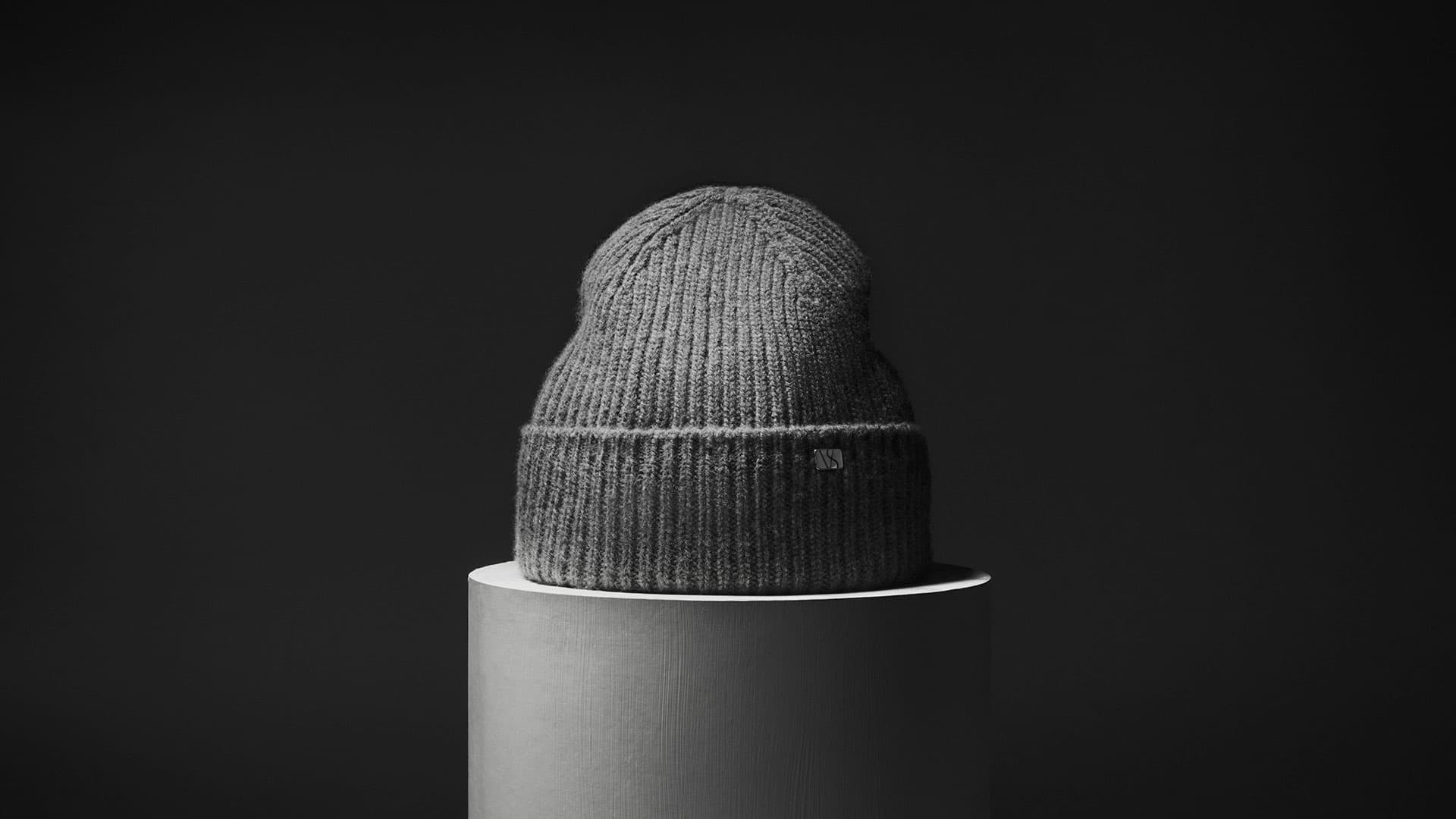 Front view of a grey cashmere wool blend beanie from Varsity Headwear