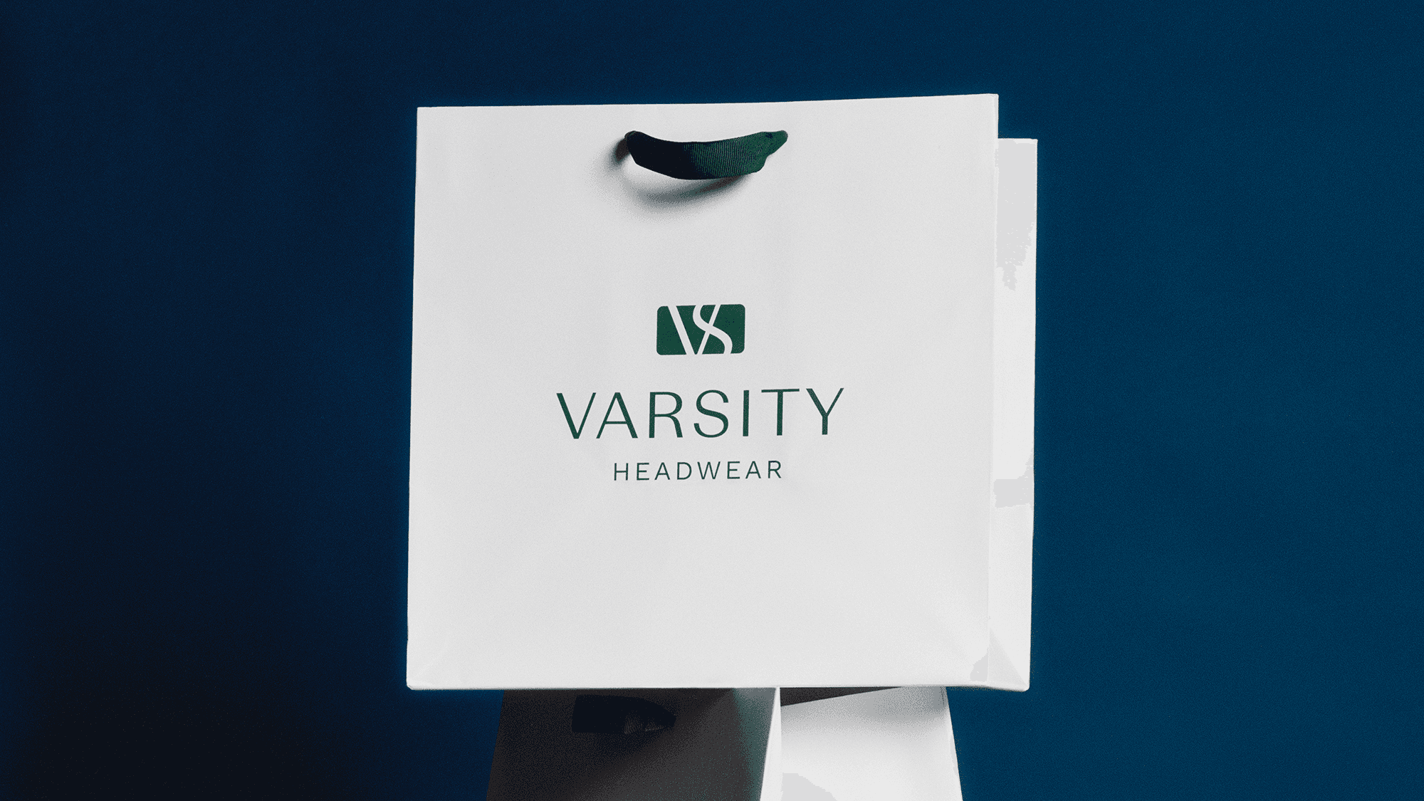 front view of a varsity headwear shopping bag