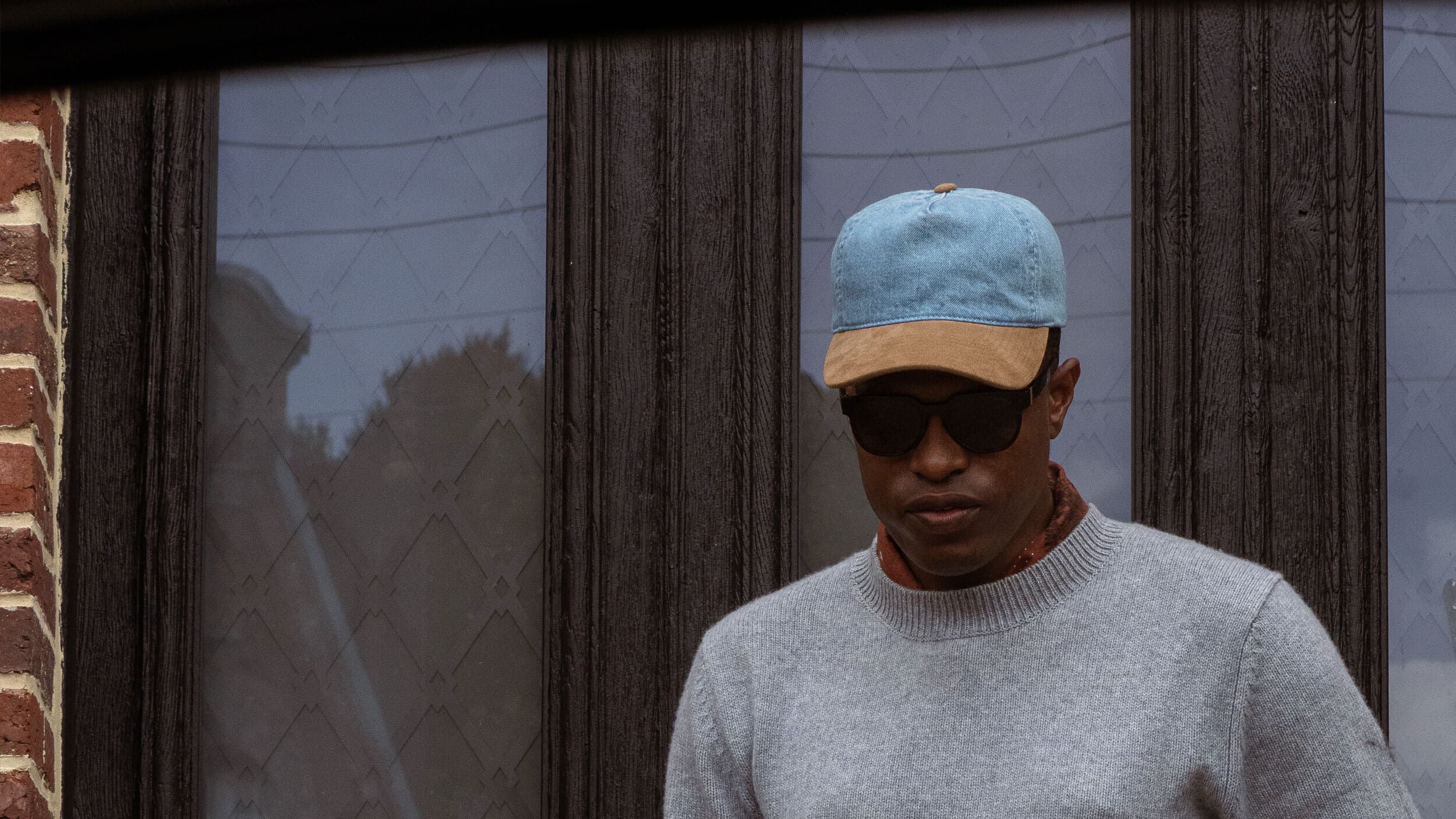 Front view of male wearing cruz soft dual cap in denim and alcantara