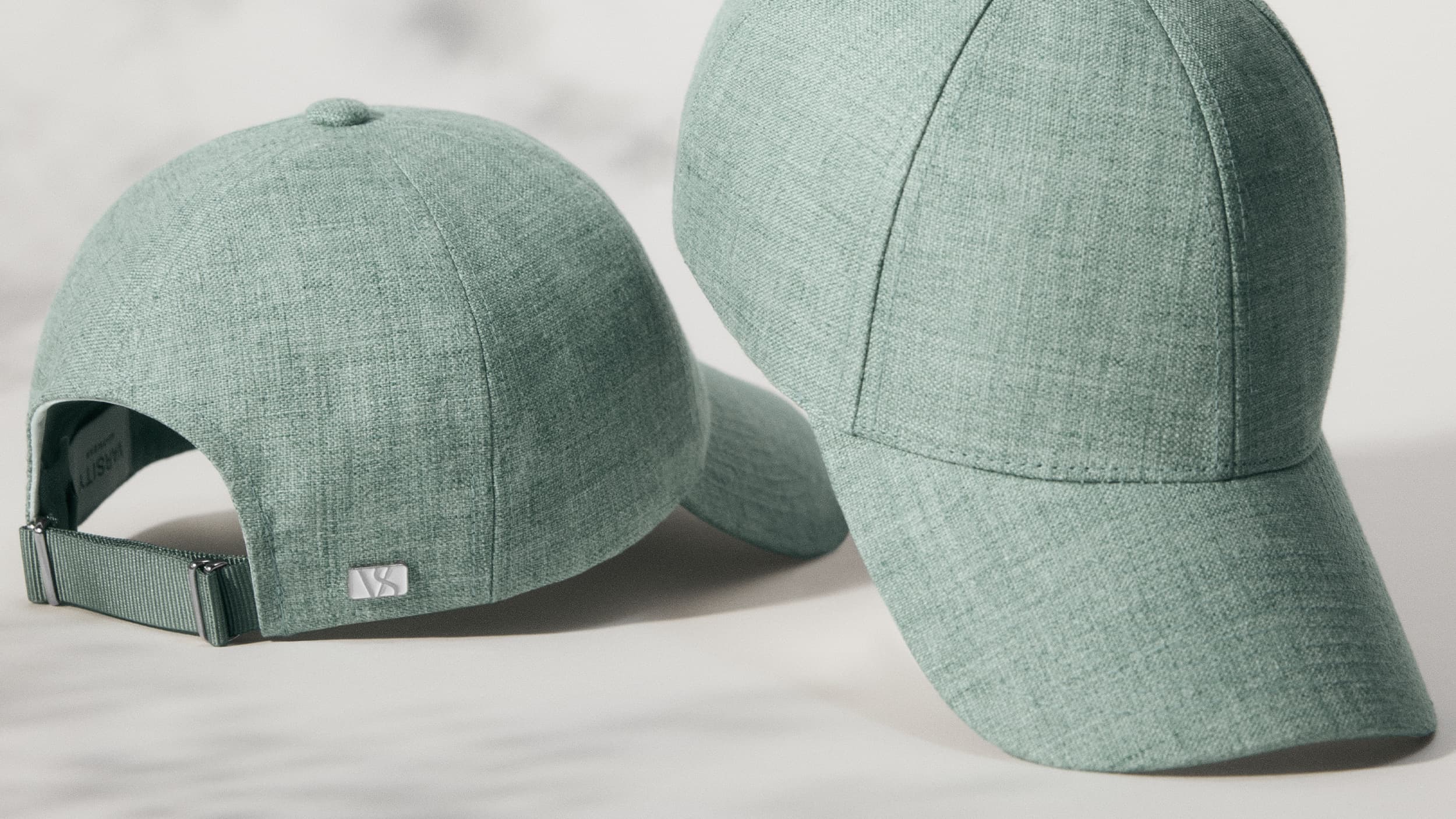Front image of cyan green linen caps