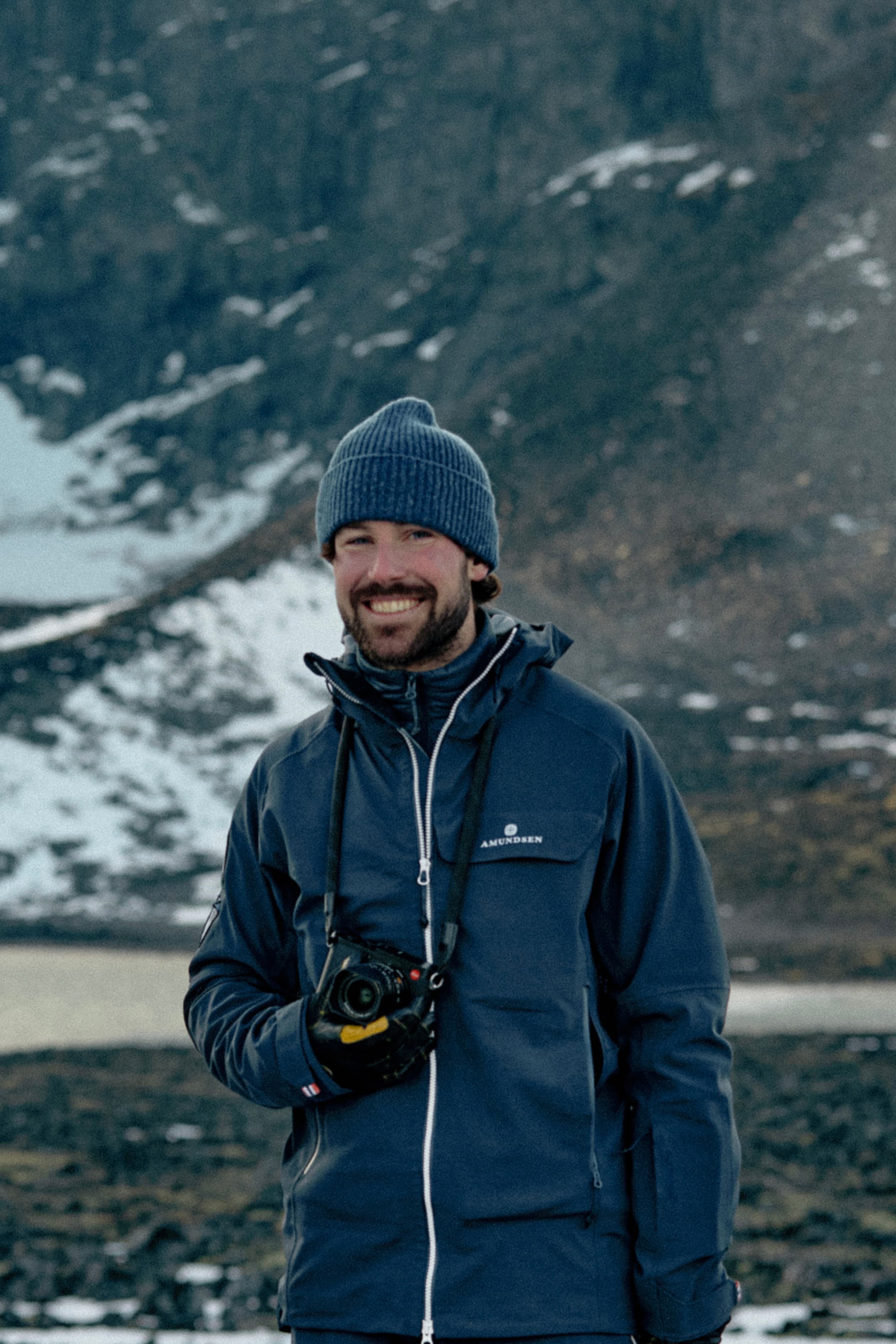 Picture of photographer under campaign shoot for holiday 24 for varsity headwear in norwegian landscape