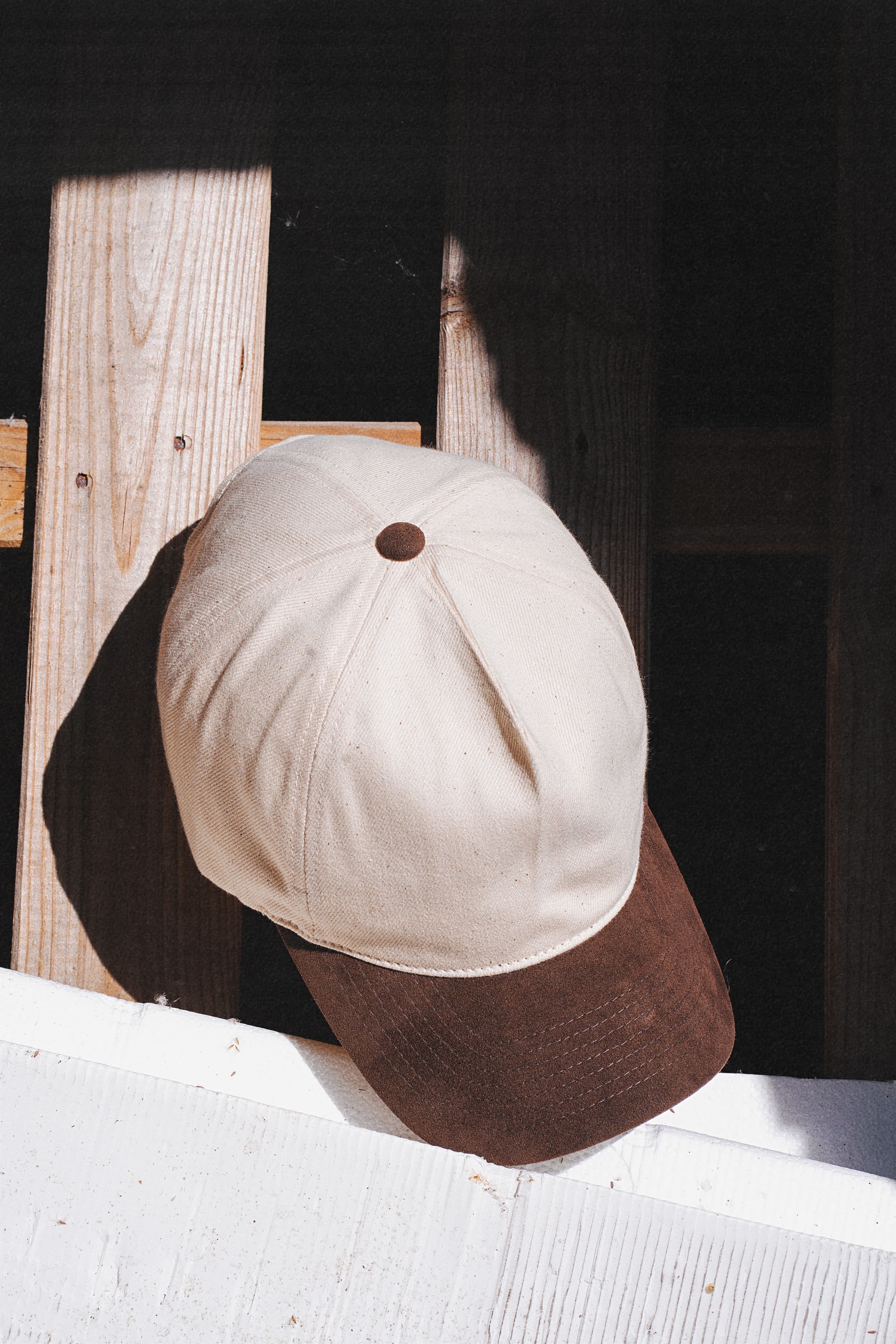 Front view of white and brown dual cruz soft cap from Varsity Headwear