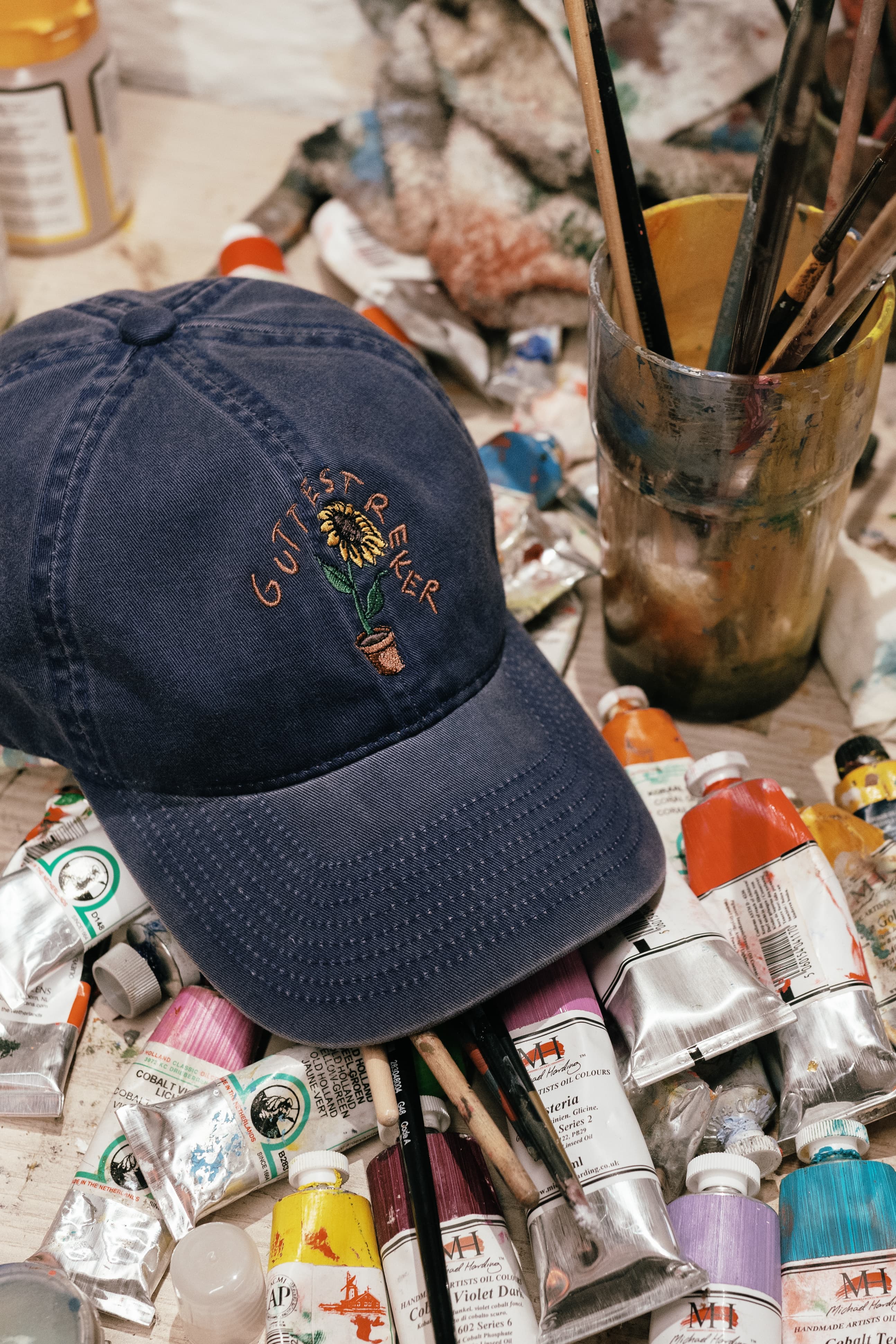 Front view of a washed cotton navy cap collaboration cap between varsity headwear and guttestreker