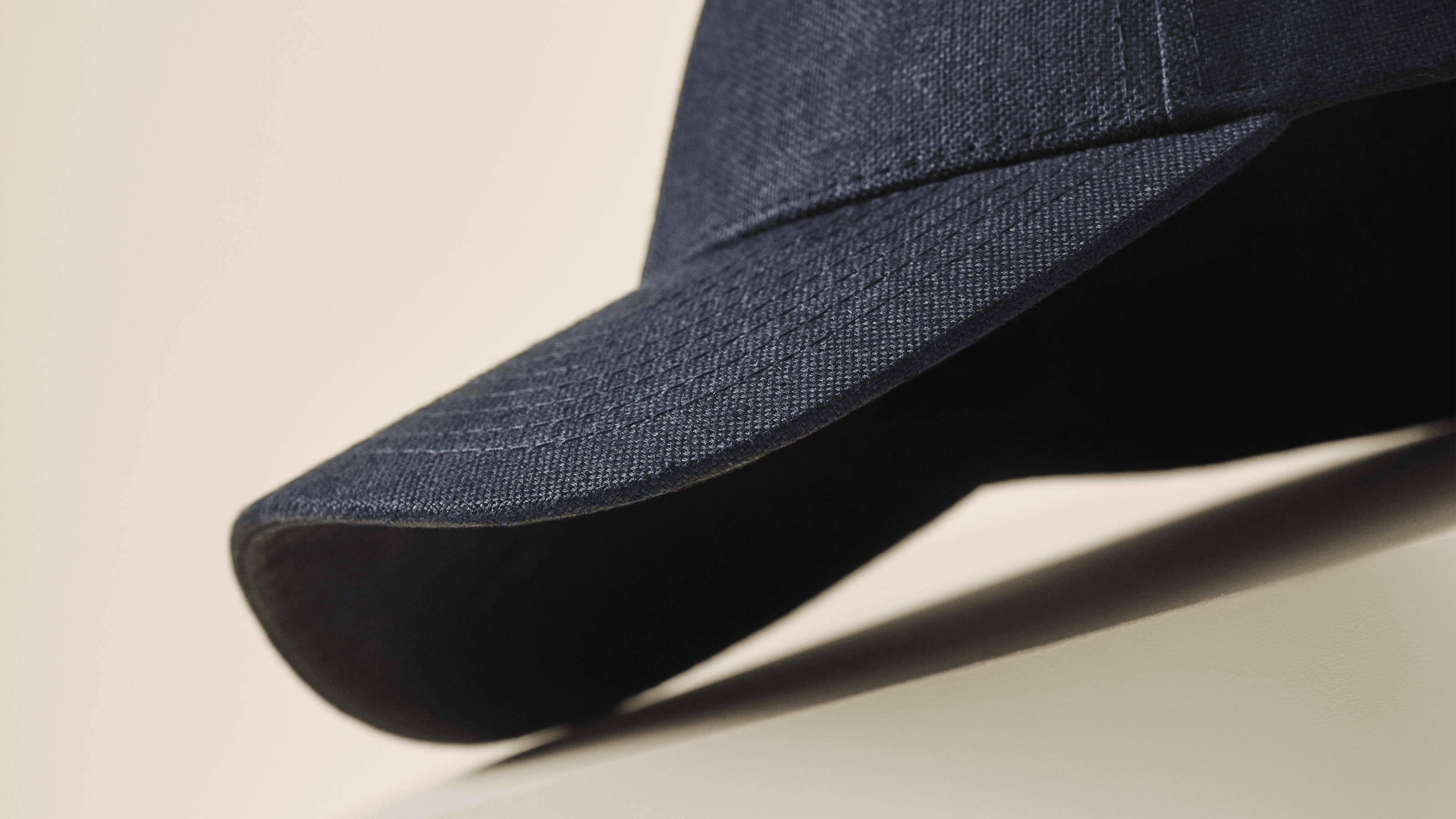 Studio image and side view of dark navy linen cap