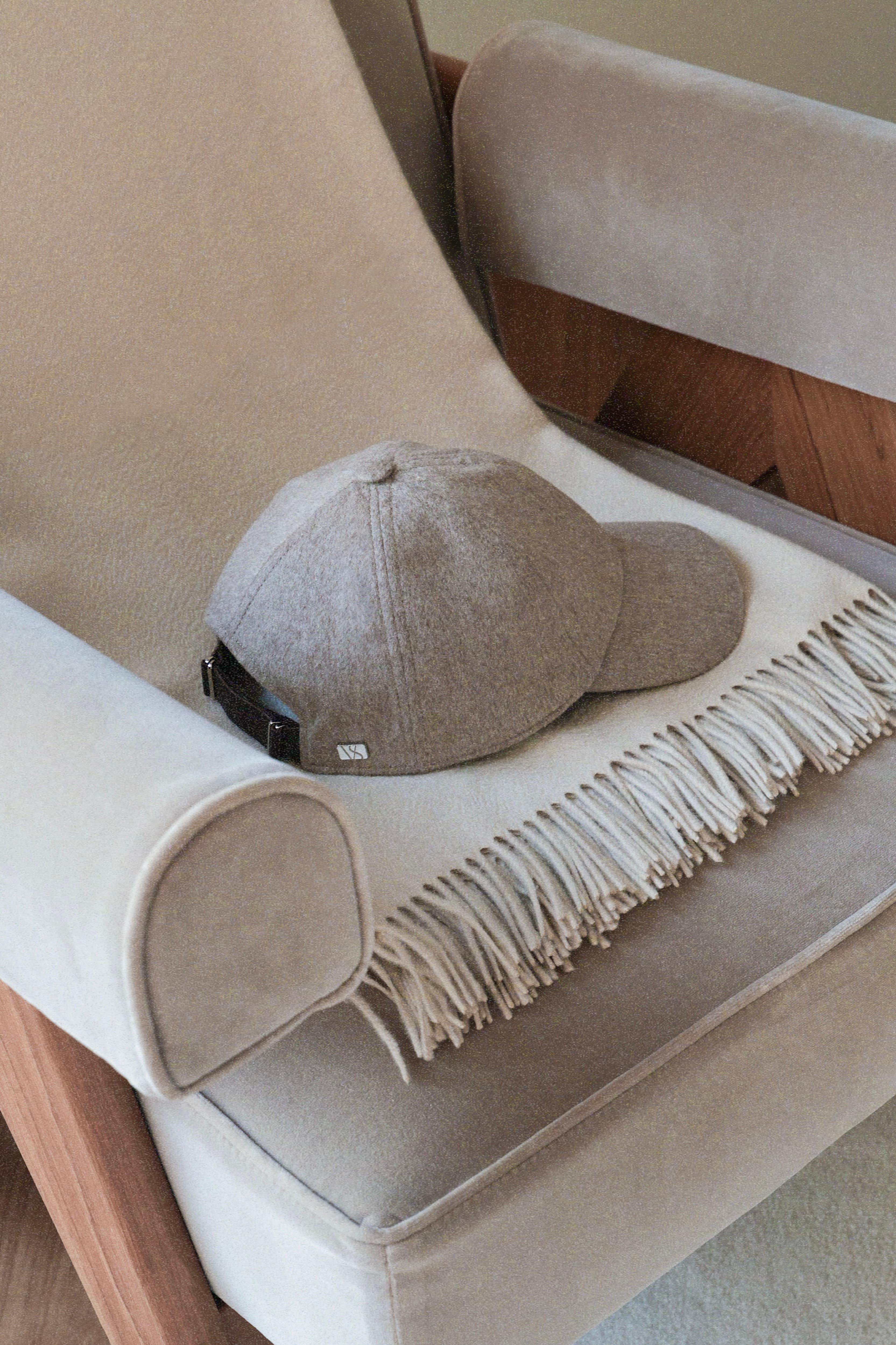 Side view of Loro piana cashmere cap in marble beige