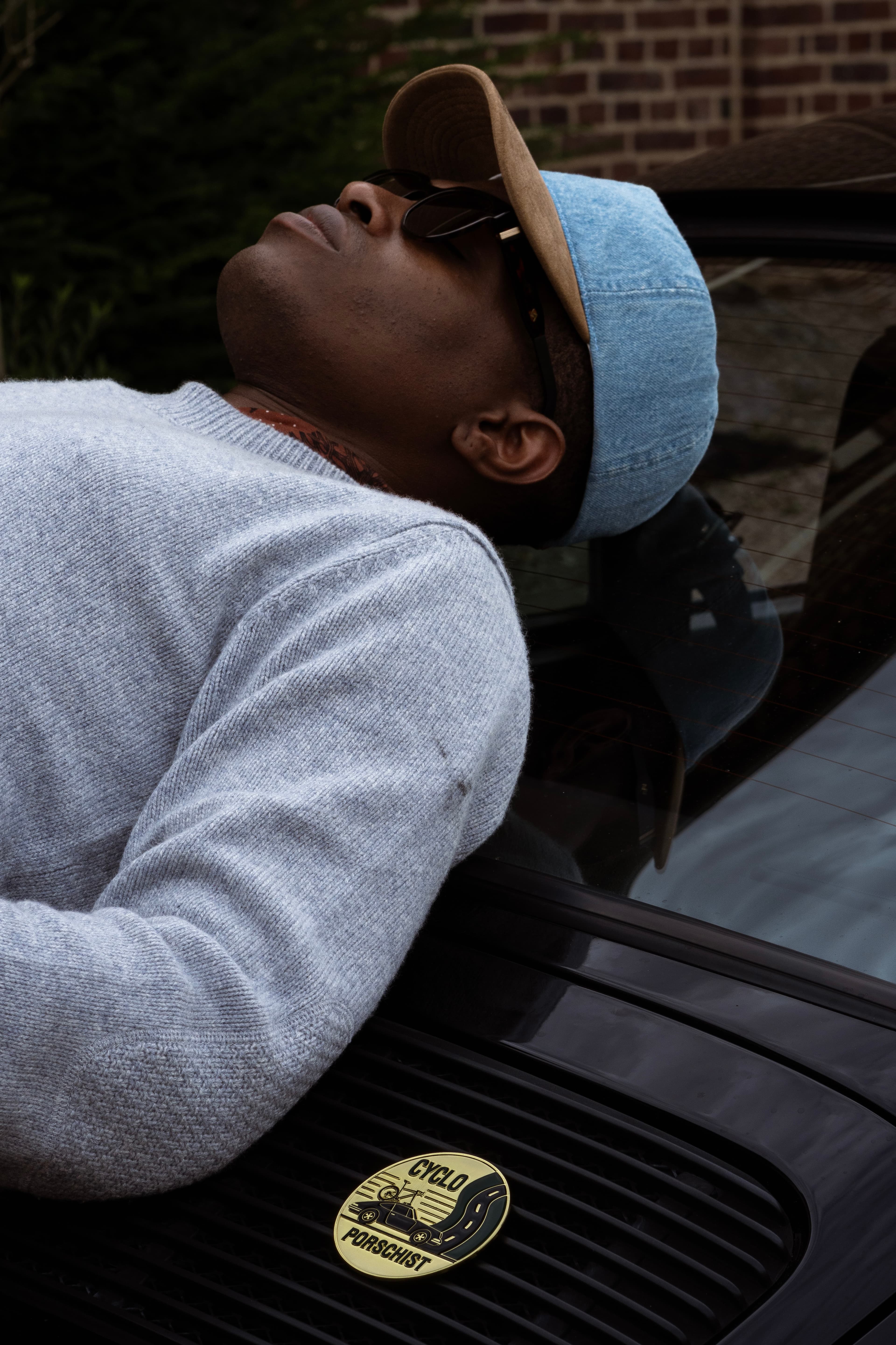 Side view of male model wearing the Cruz Soft dual cap in denim and alcantara