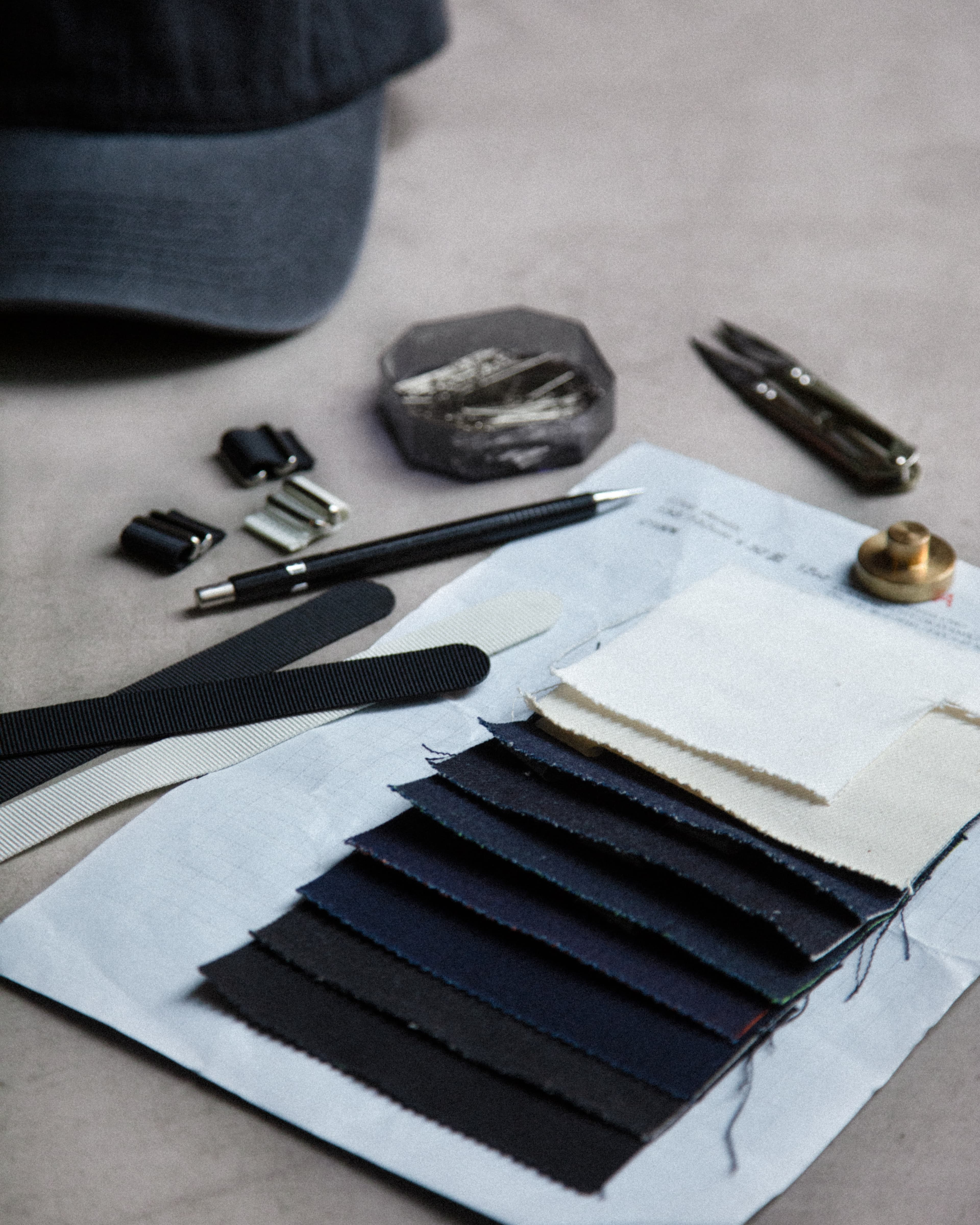 Behind the scenes photo of working with washed denim cap