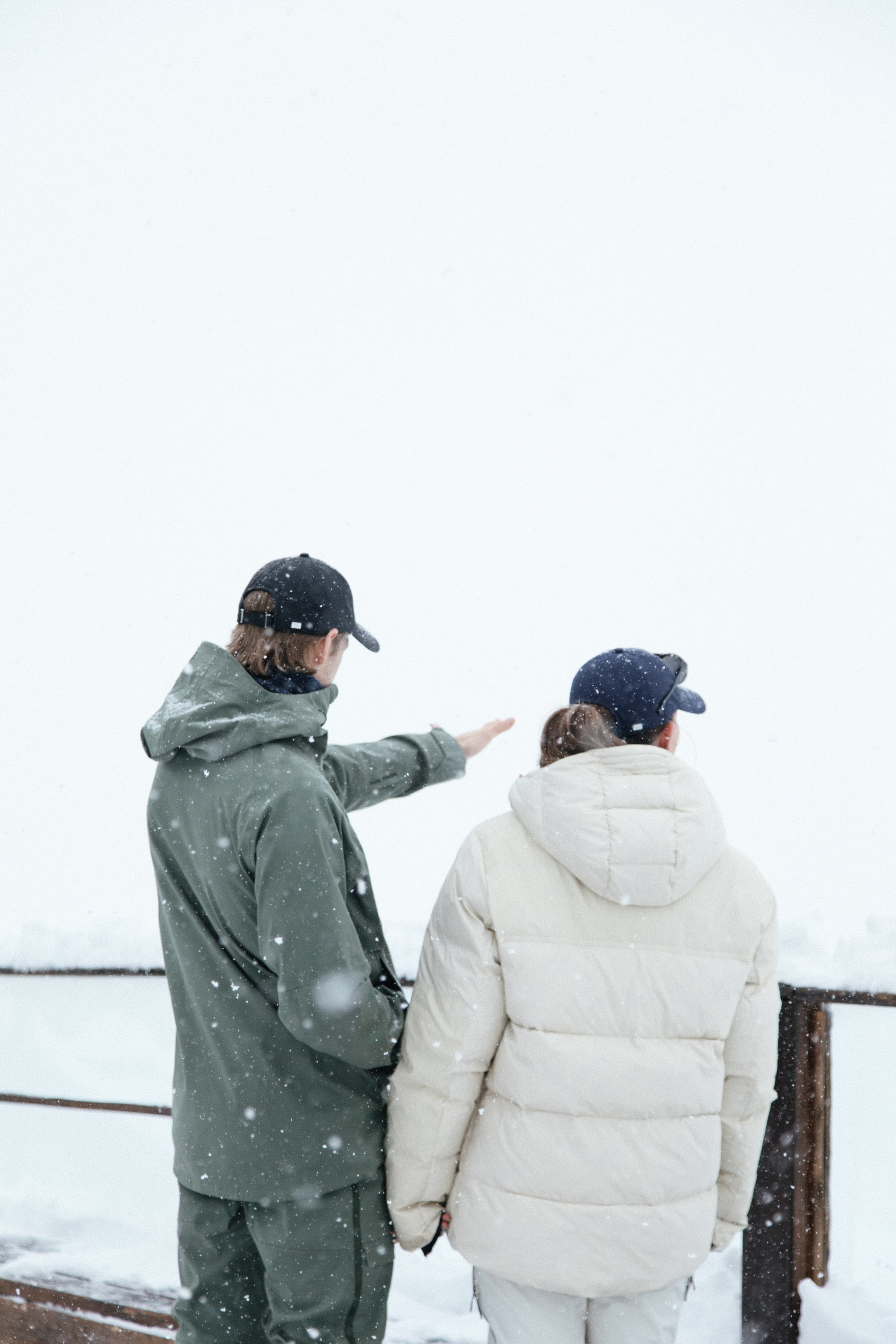 Back view of varisty headwear team in winter environment