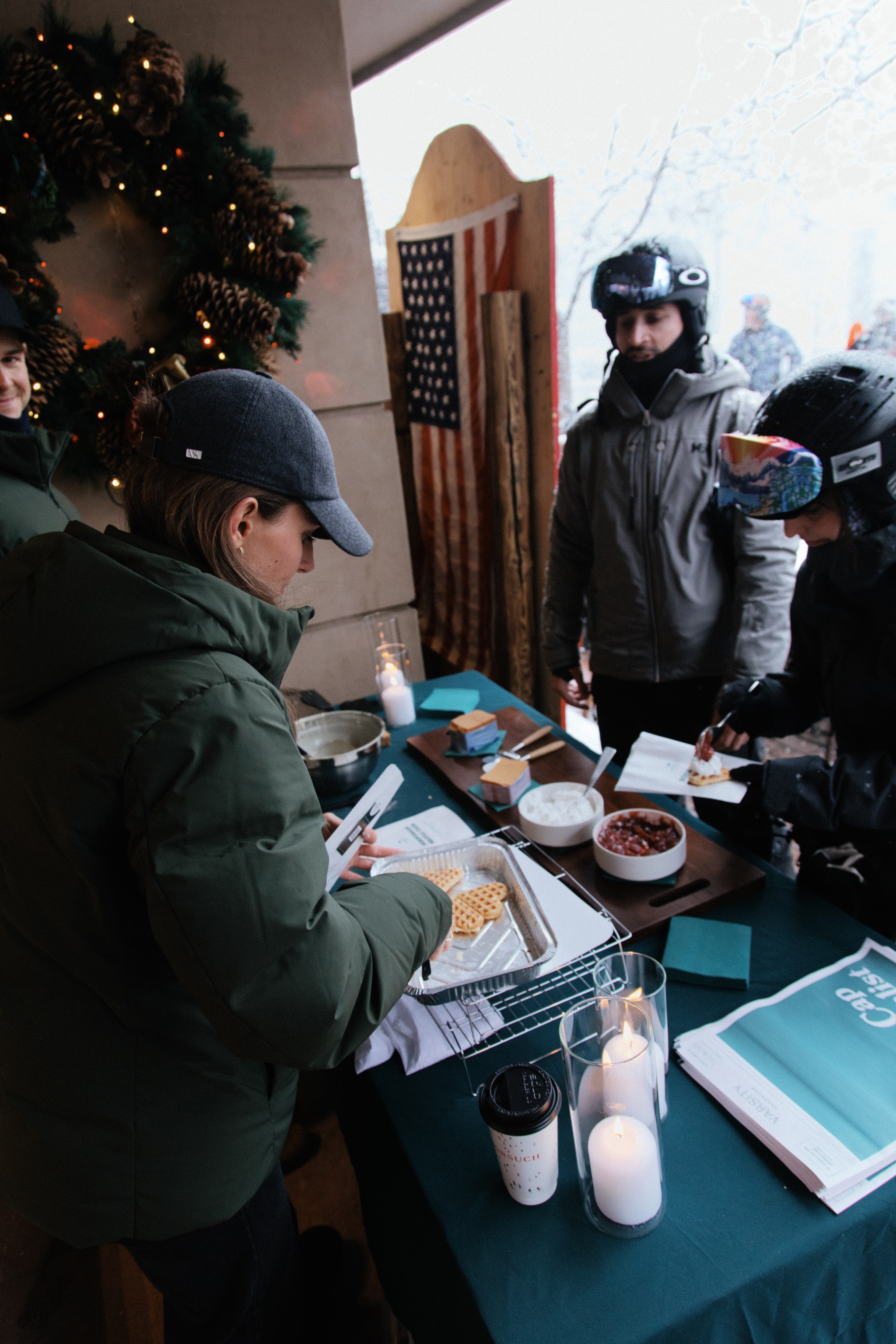 Back view of Varsity Headwear serving waffels to community at Gorsuch Aspen