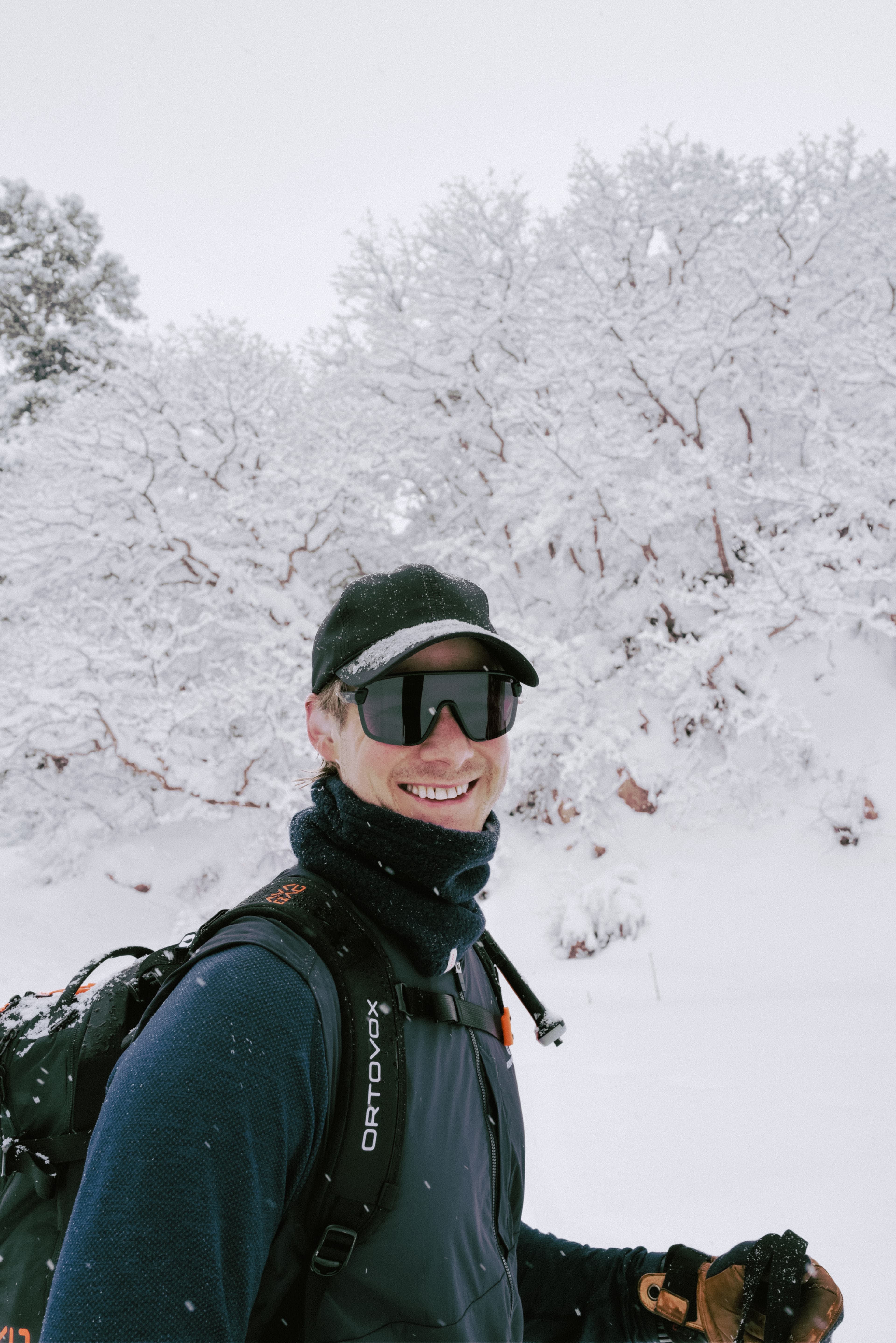 Front view of male skiier wearing active tech in snow