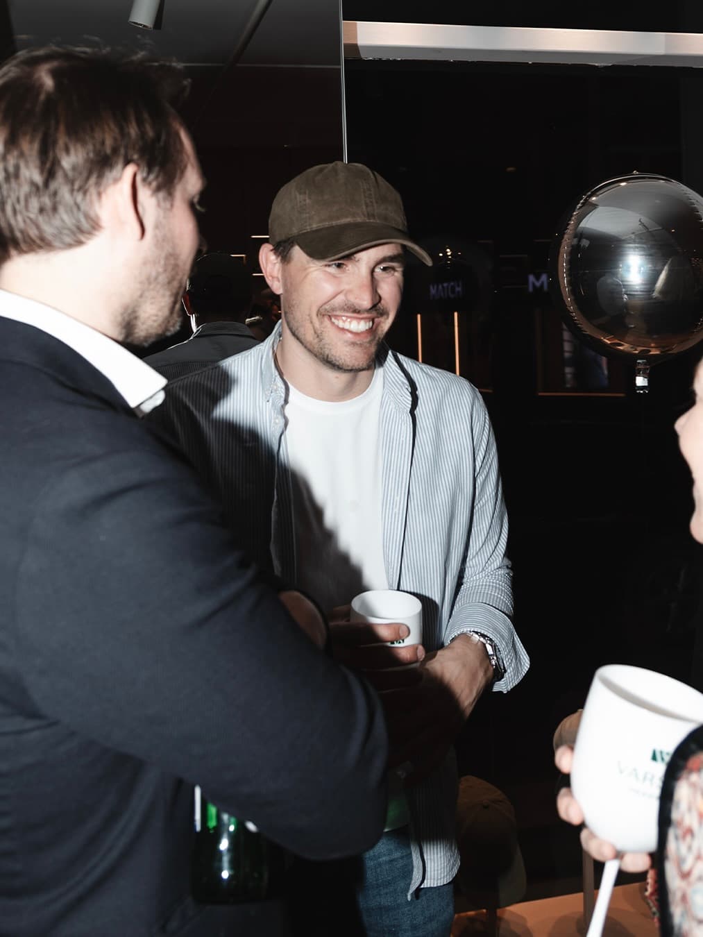 Socializing at opening event of Varsity Headwear new concept store in Oslo