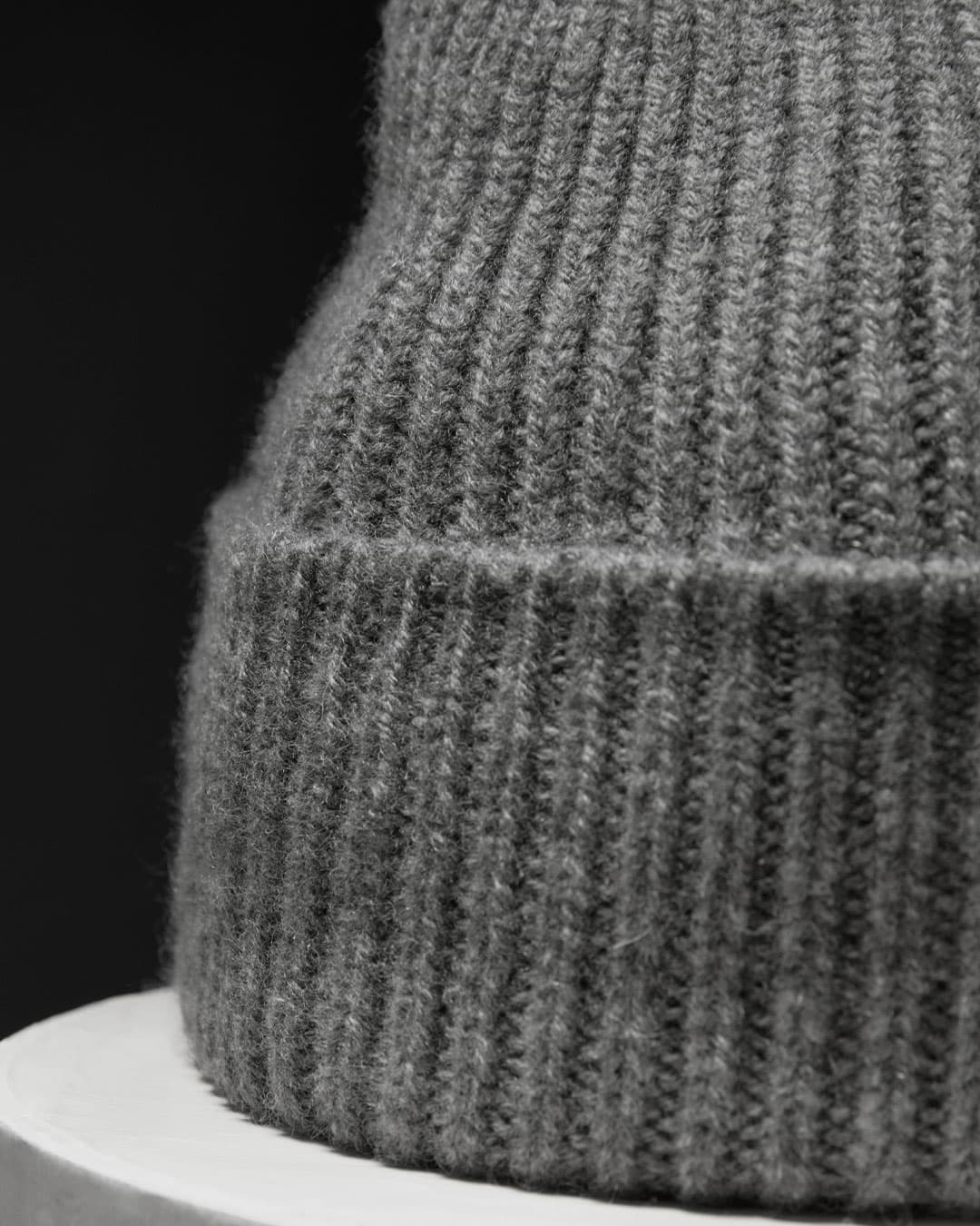 Detailed view of a grey cashmere wool blend beanie from Varsity Headwear