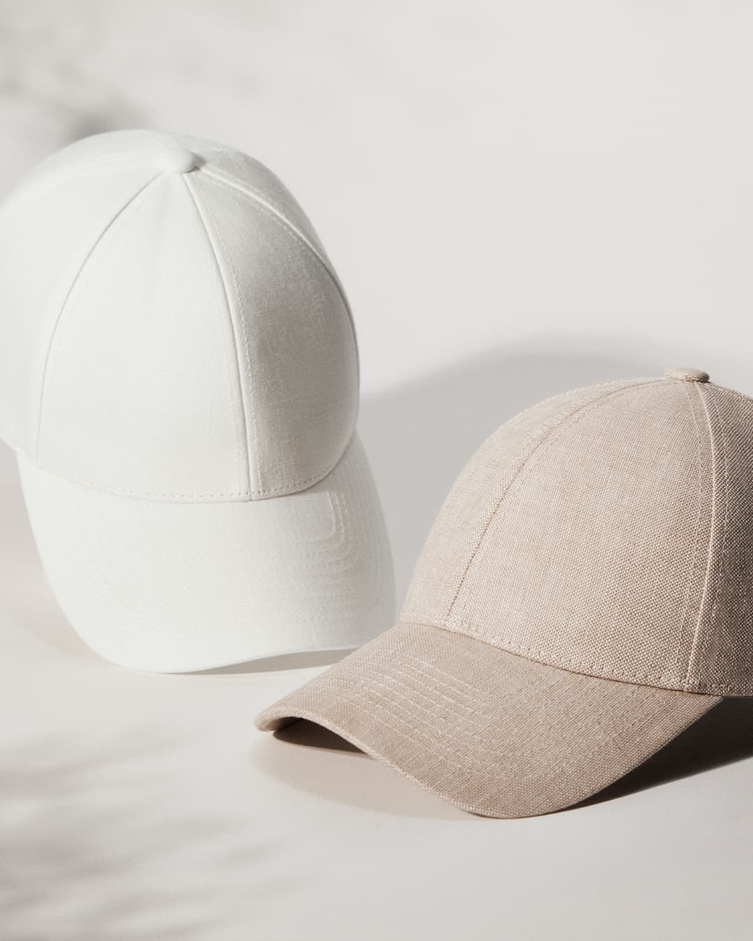 Front view of bestselling linen caps in hampton beige and shell white