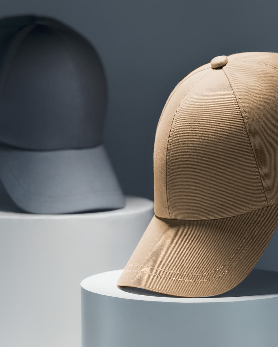 Front view of a beige and blue sea island cotton cap from varsity headwear