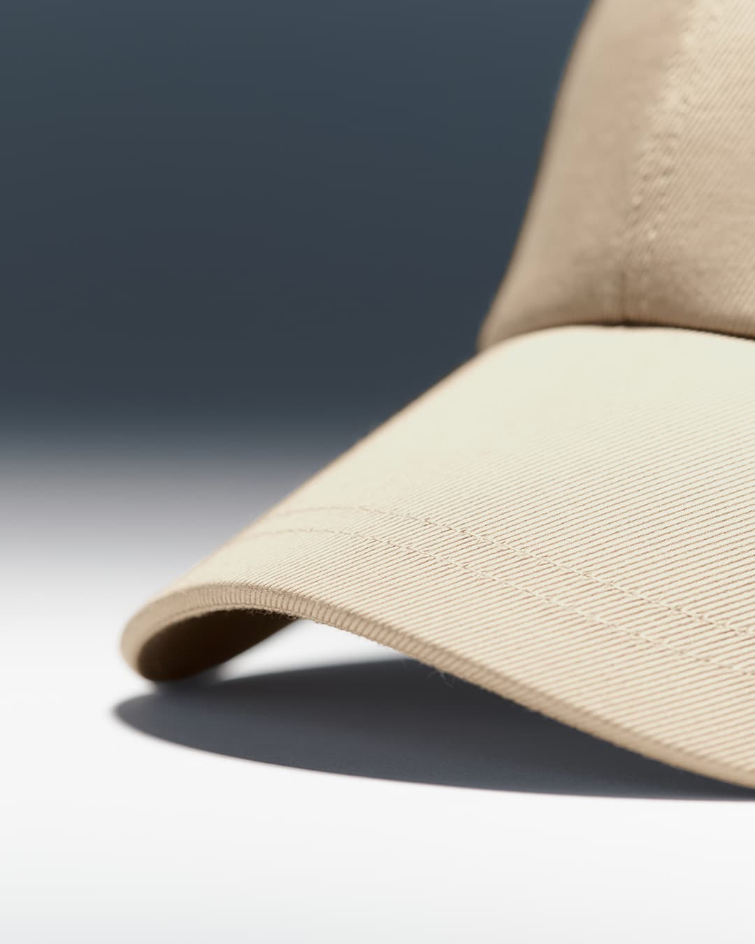 Detailed front view of a beige sea island cotton cap from varsity headwear