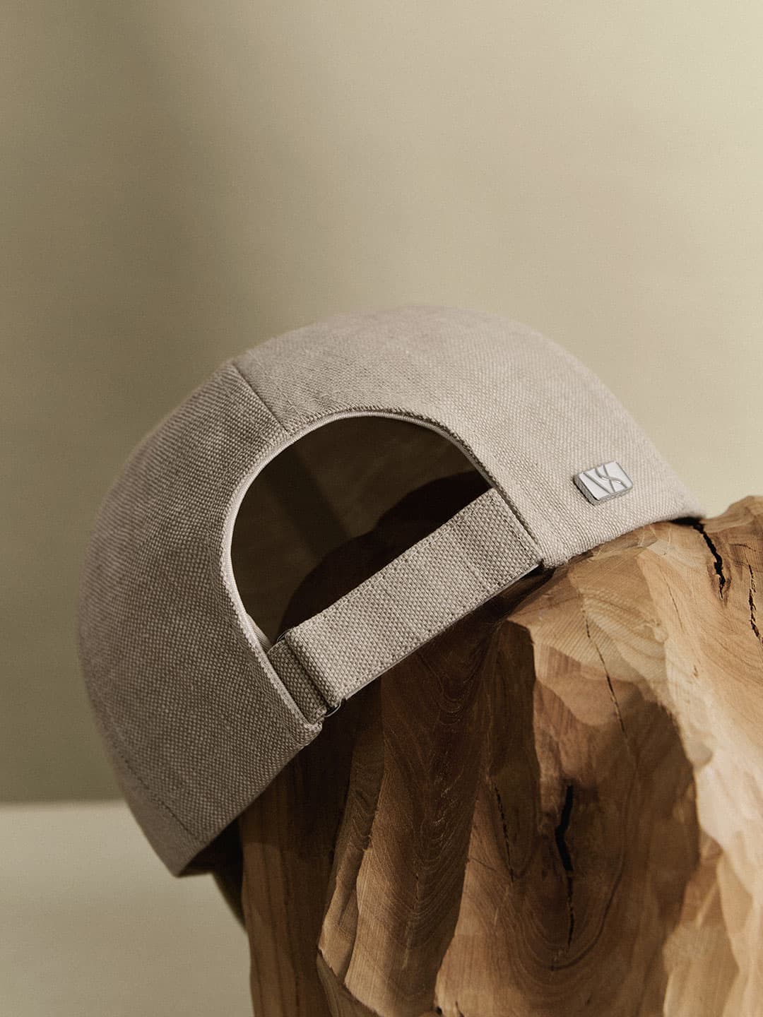 Back view of a beige linen kids cap with velcro strap from varsity headwear