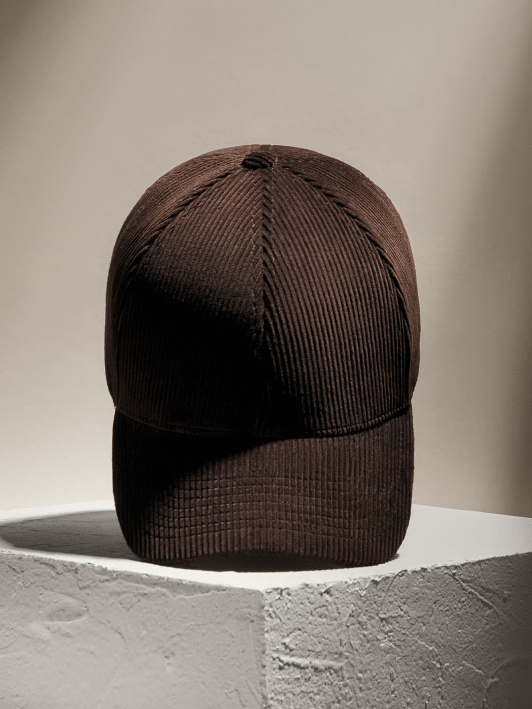 Front view of a brown legacy structured corduroy cap from varsity headwear