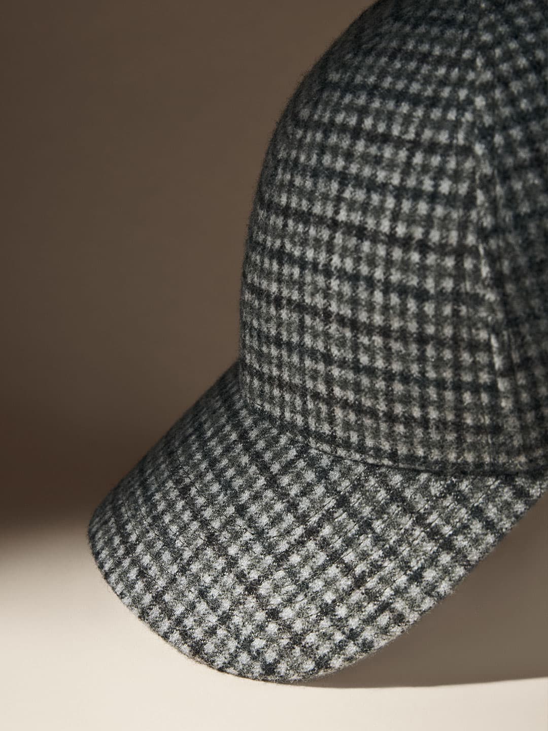 Close side-view of the checkered Olive special edition cap from Varsity Headwear AW25 collection