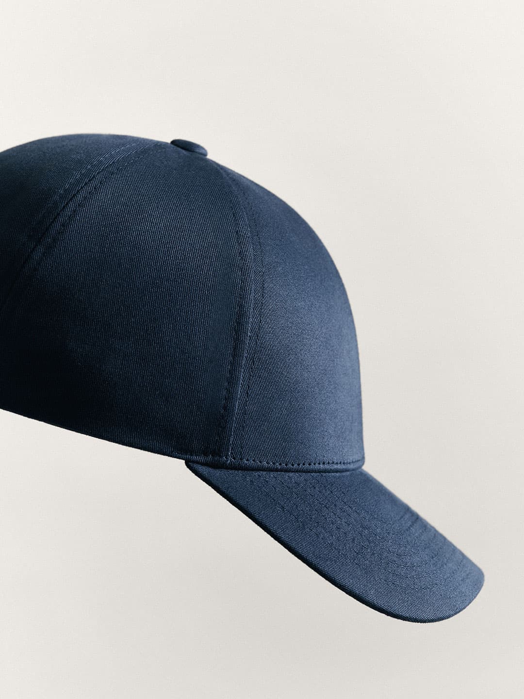 A dark blue Cotton Twill baseball cap in Legacy Structured shape, set against a plain light gray background.