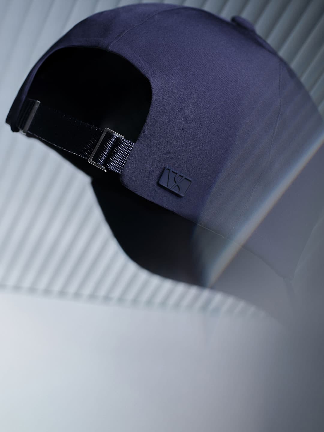 Detailed back view of the back strap on an mid intensity sport cap from Varsity Headwear