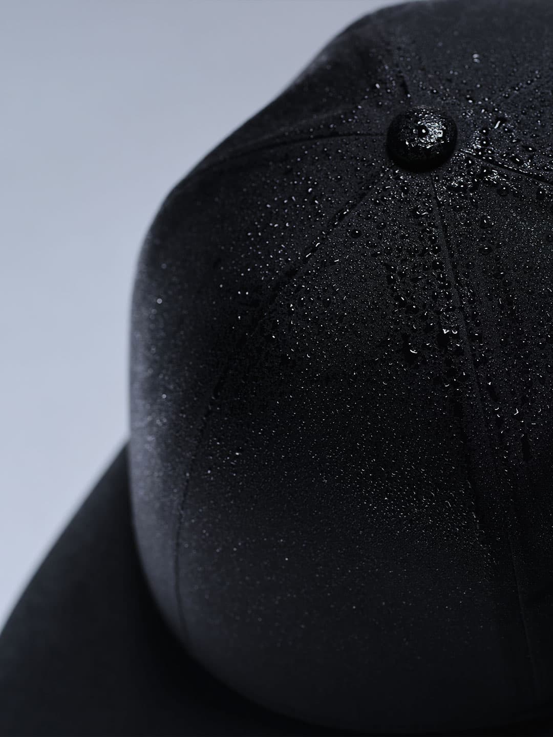 Close view of an low intensity sport cap from Varsity Headwear showing the Waterproof construction of the material.