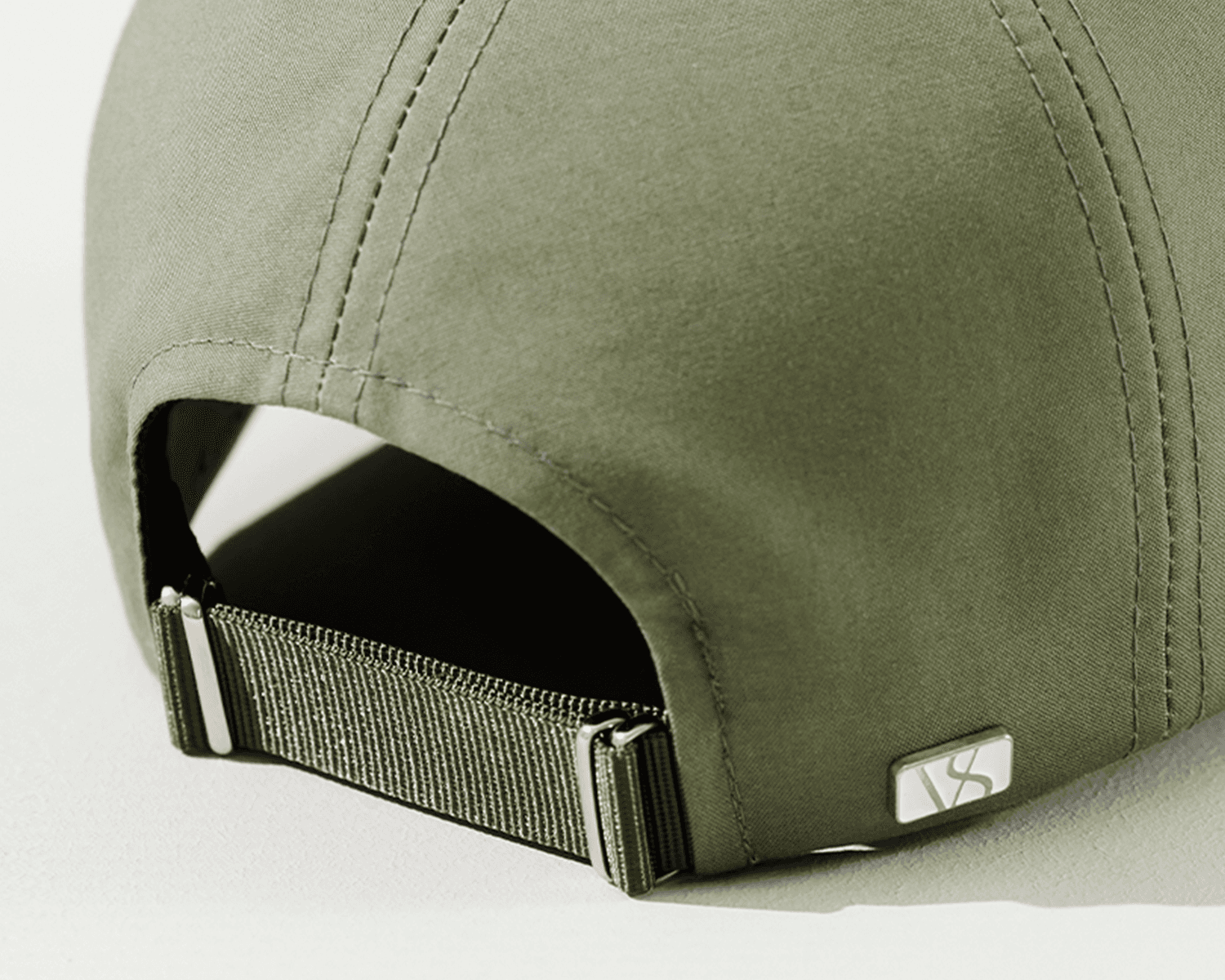 Back view of a green ventile cotton cap from varsity headwear