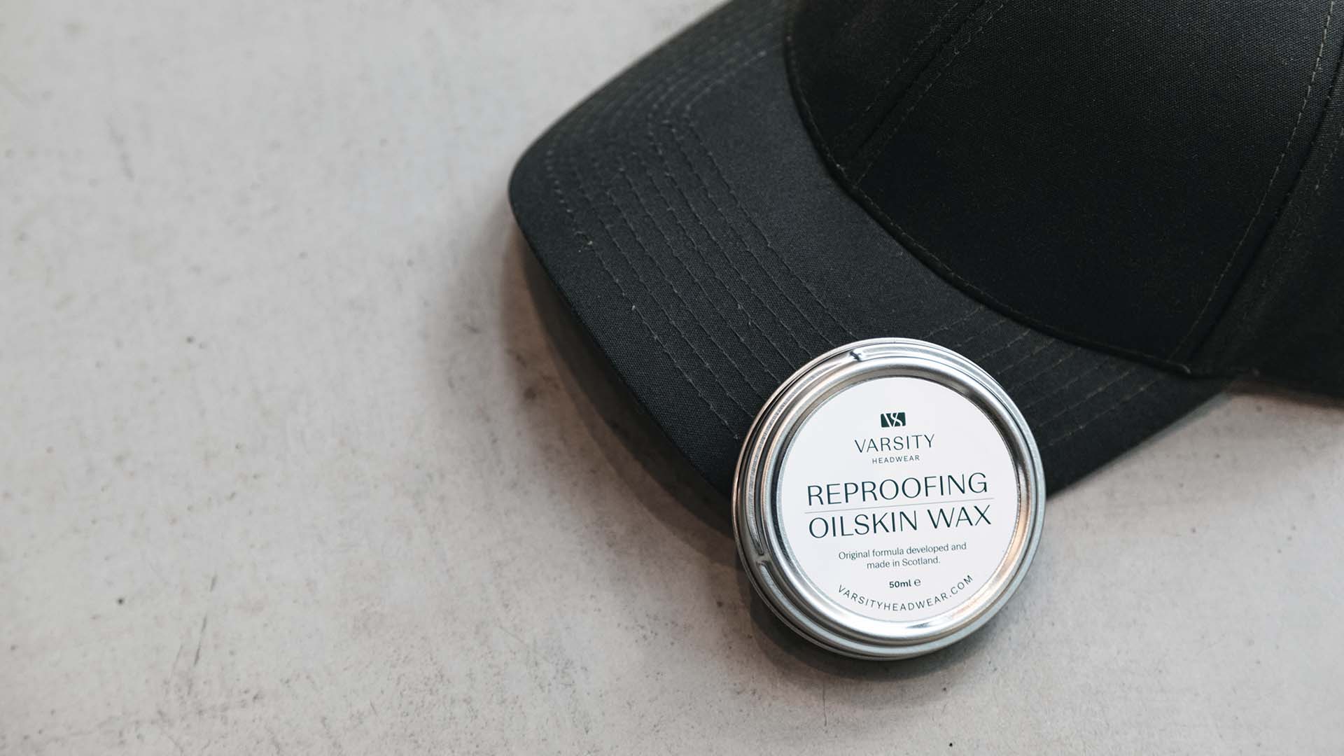 Black oilskin cap from varsity headwear with a reproofing oilskin wax