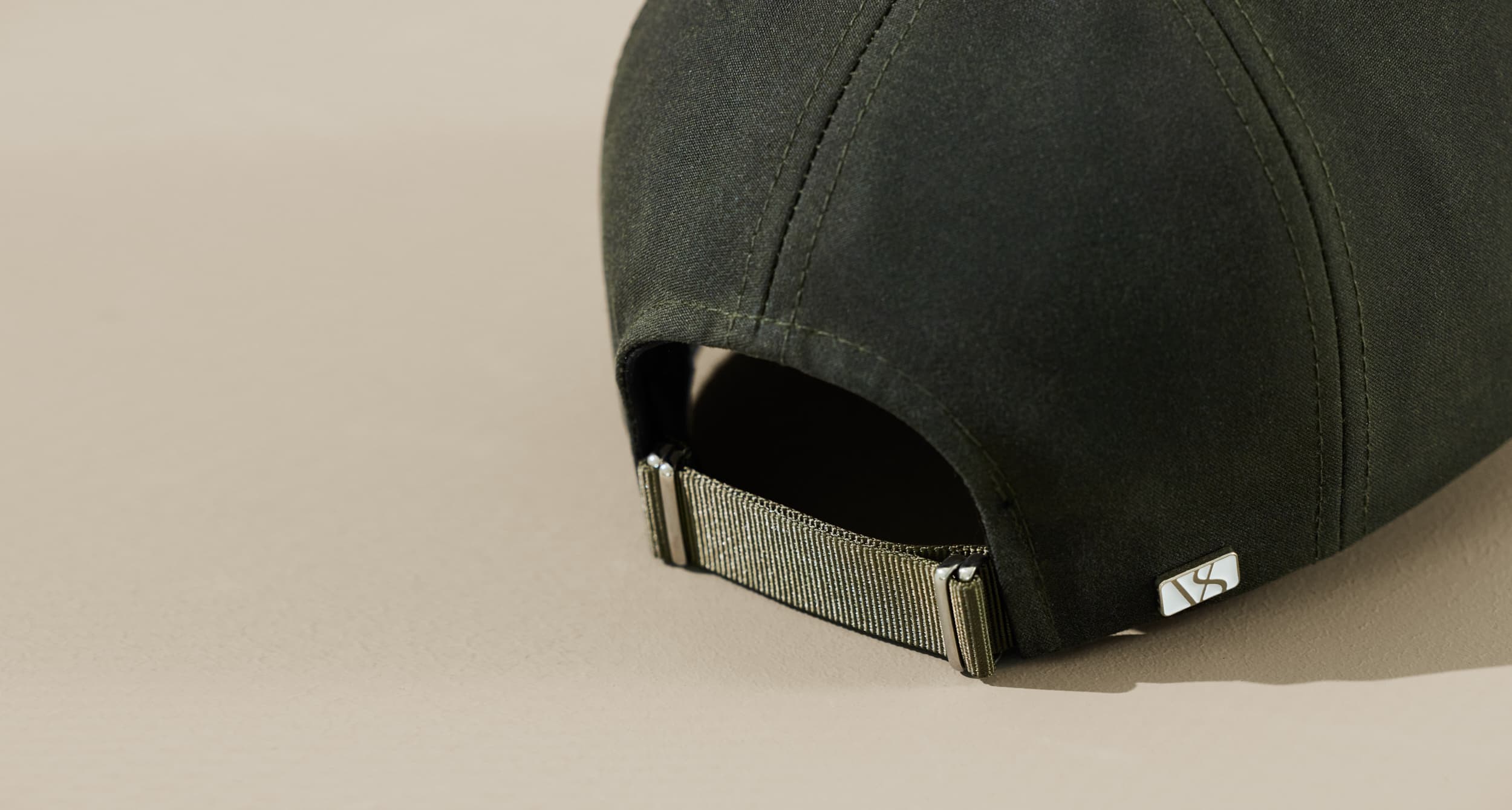 Back View of a green oilskin cap from varsity headwear