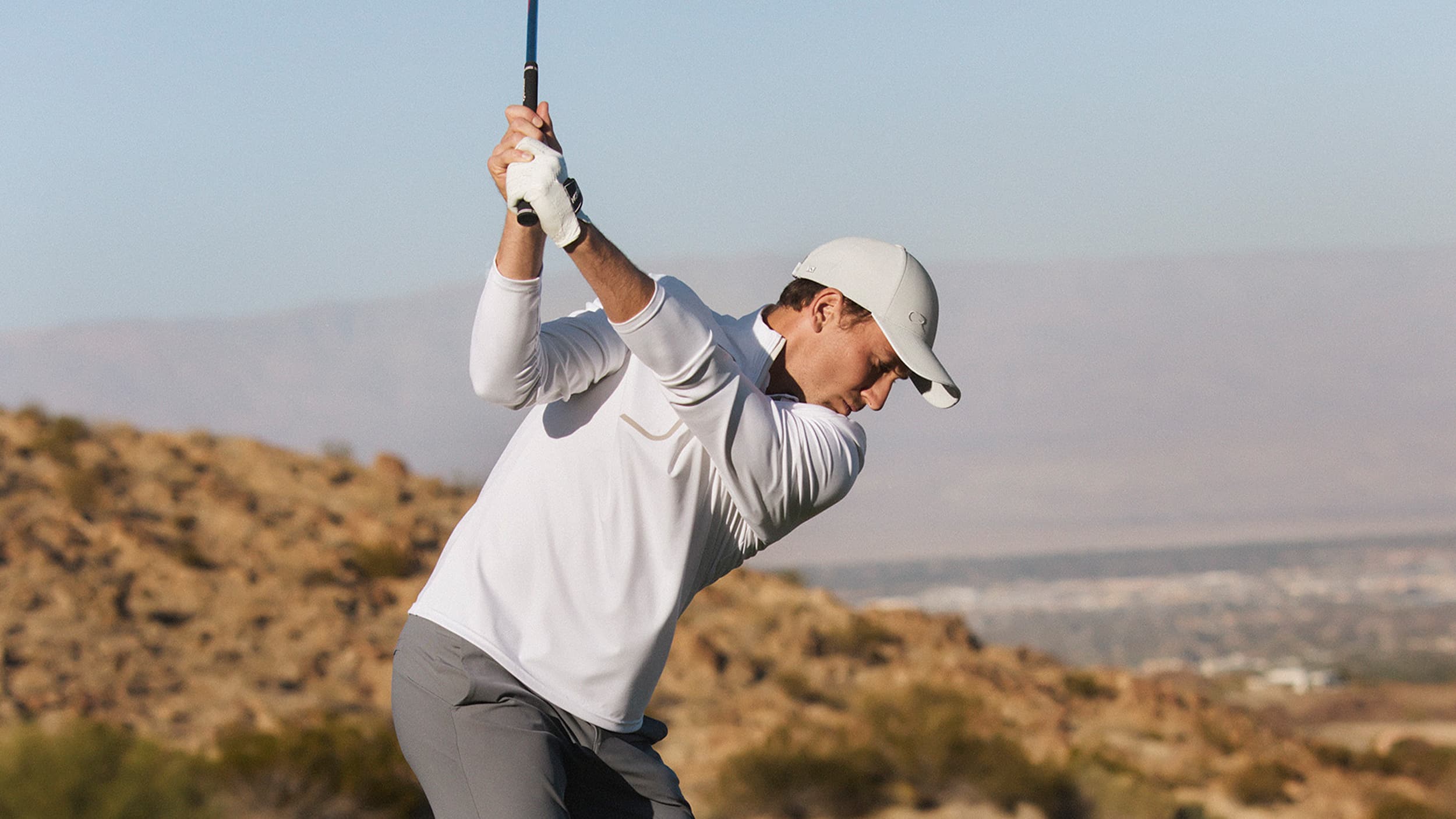 Tennis star Casper Ruud playing golf wearing his off-court cap
