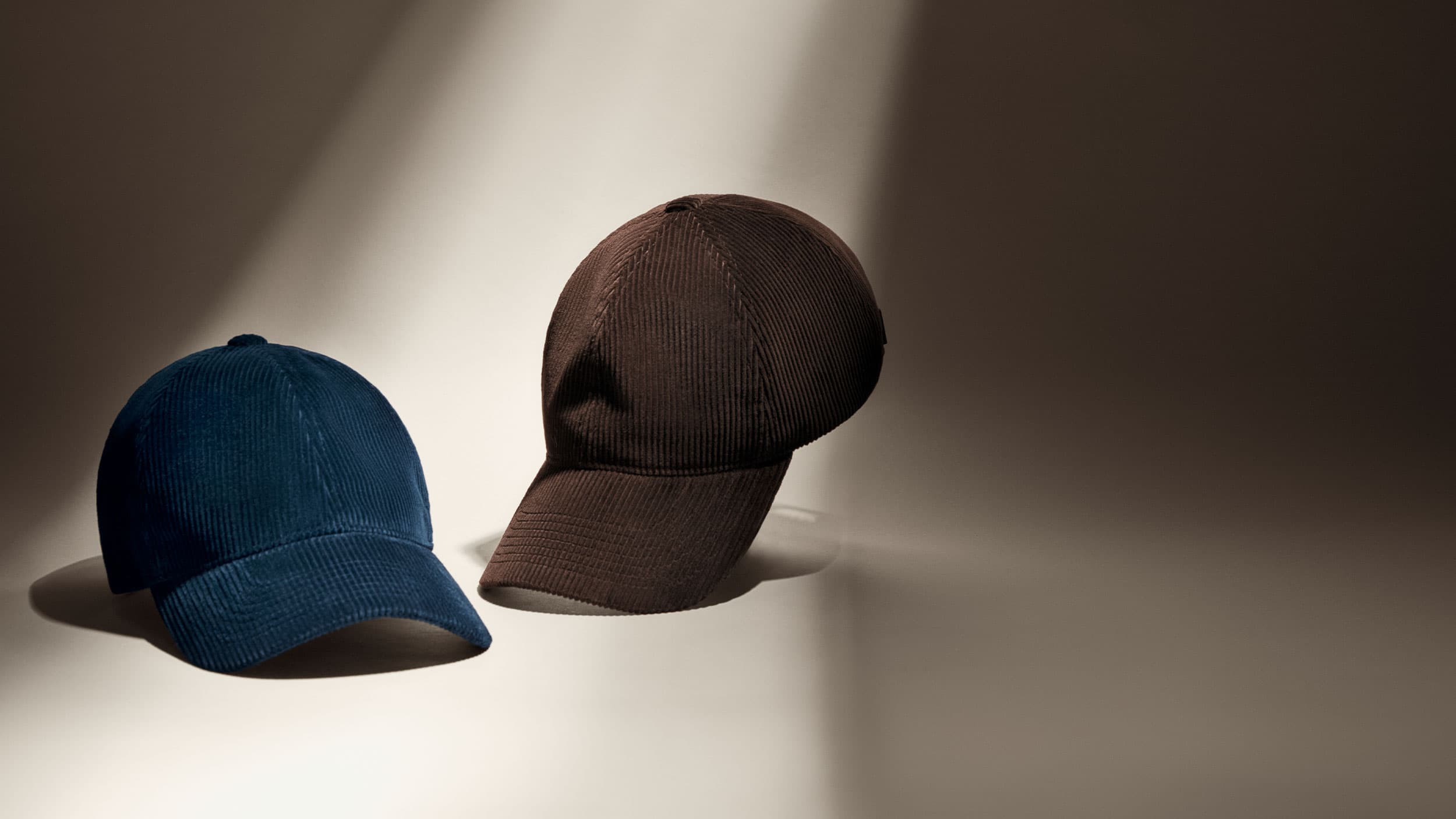 Front view of navy and brown corduroy caps from Varsity Headwear