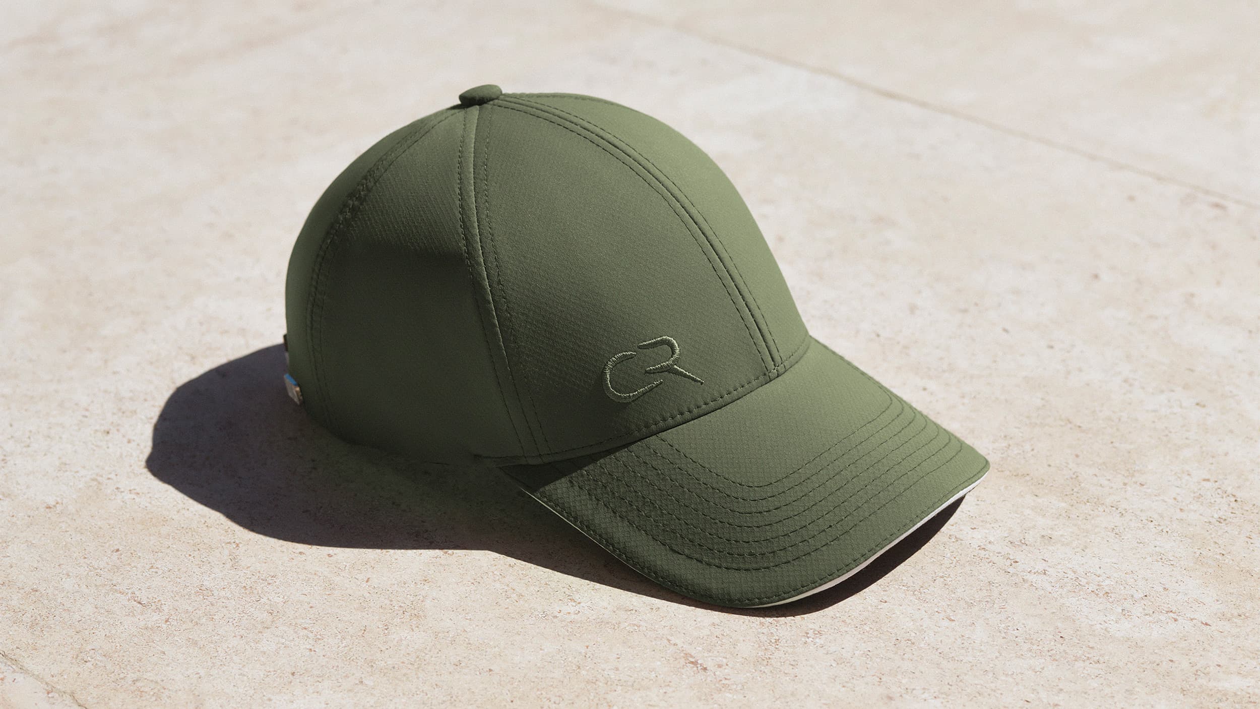 Side view of Casper Ruud cap in green designed in collaboration with Varsity Headwear
