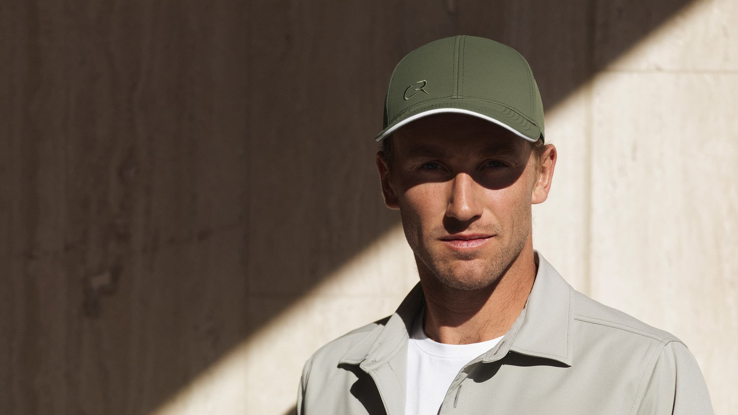 Tennis player Casper Ruud wearing the off-court cap from Varsity Headwear in green