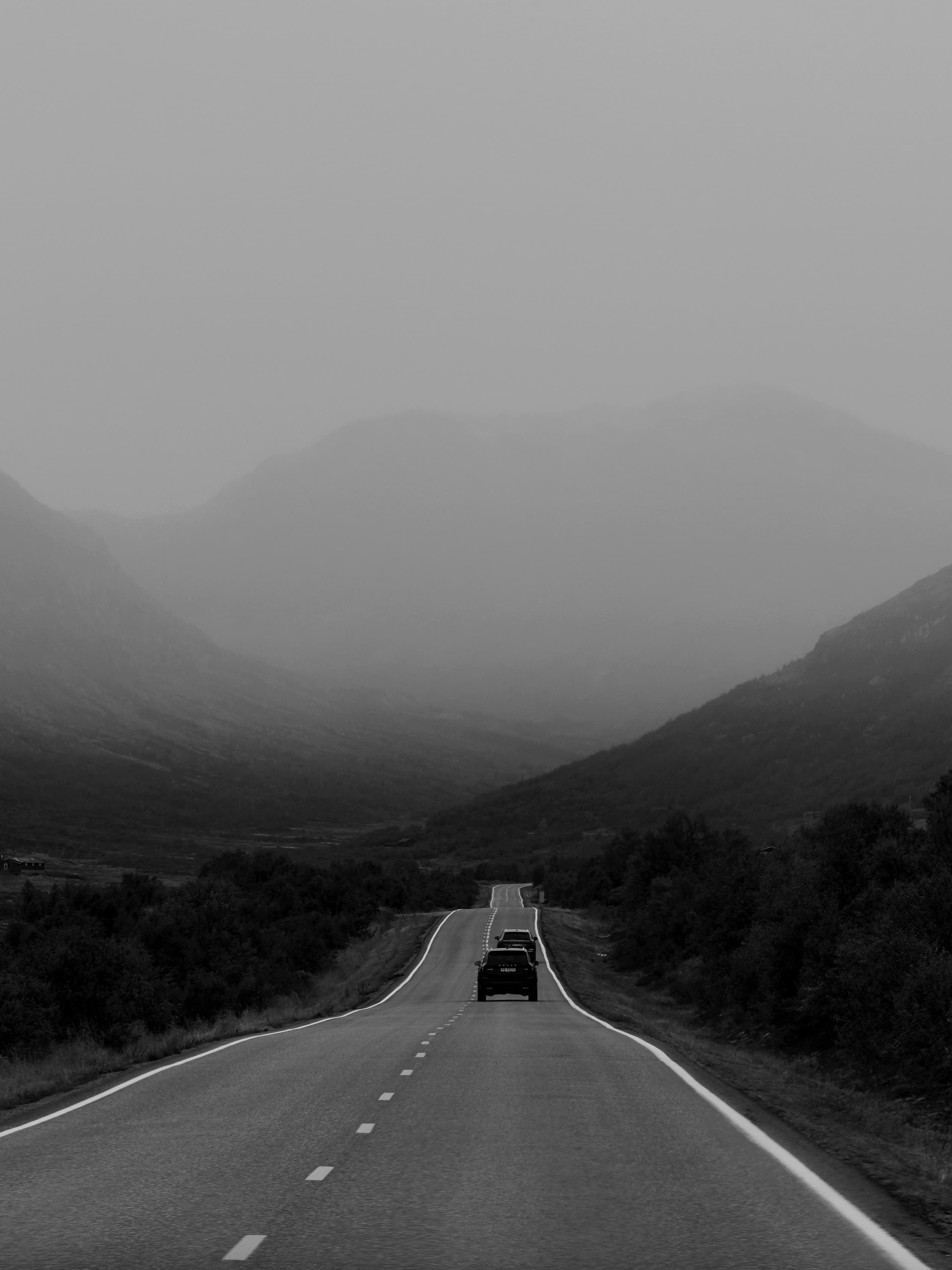 Landscape image of a road and Norwegian nature