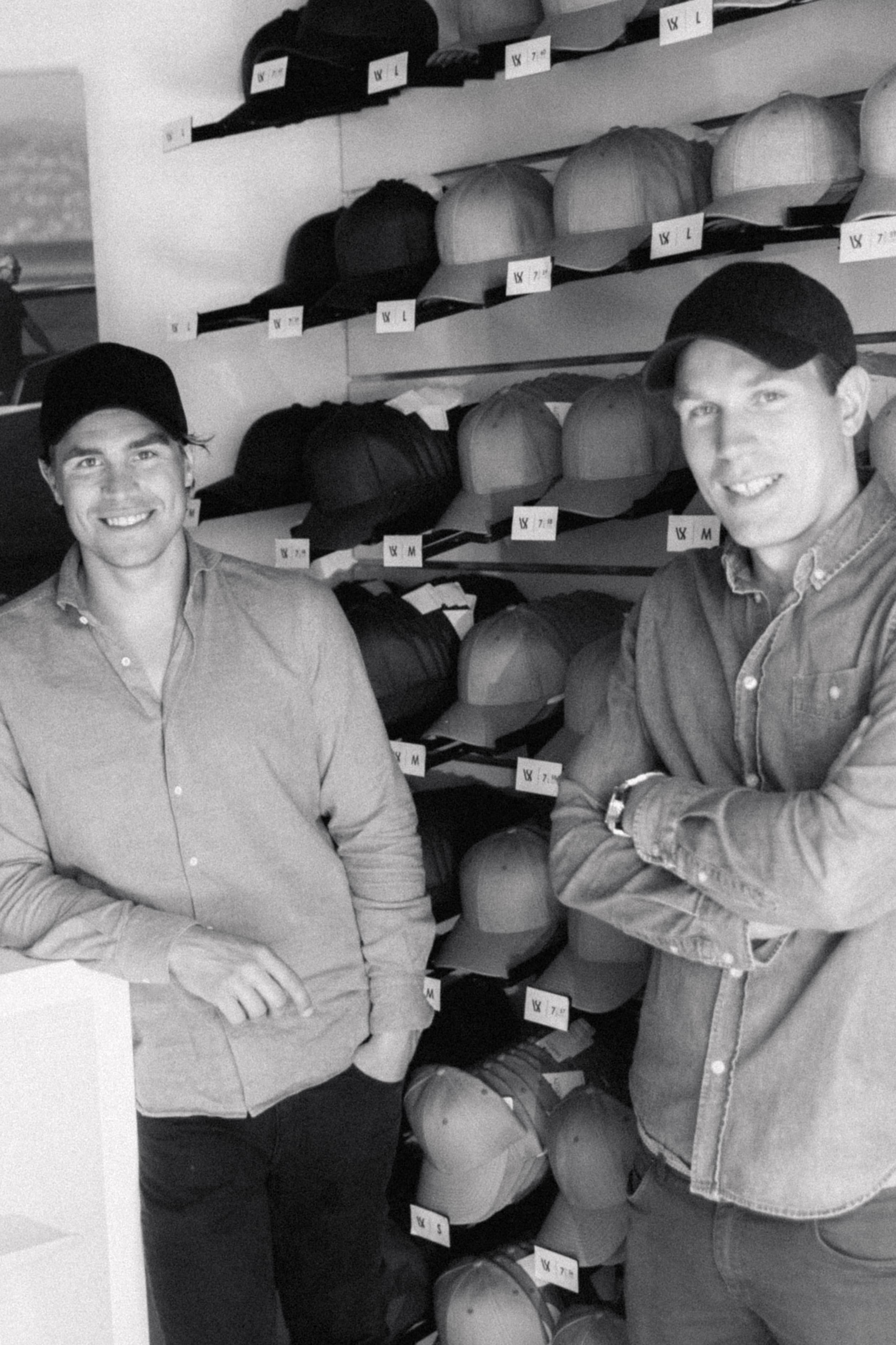 Founders of Varsity Headwear in front of their first caps