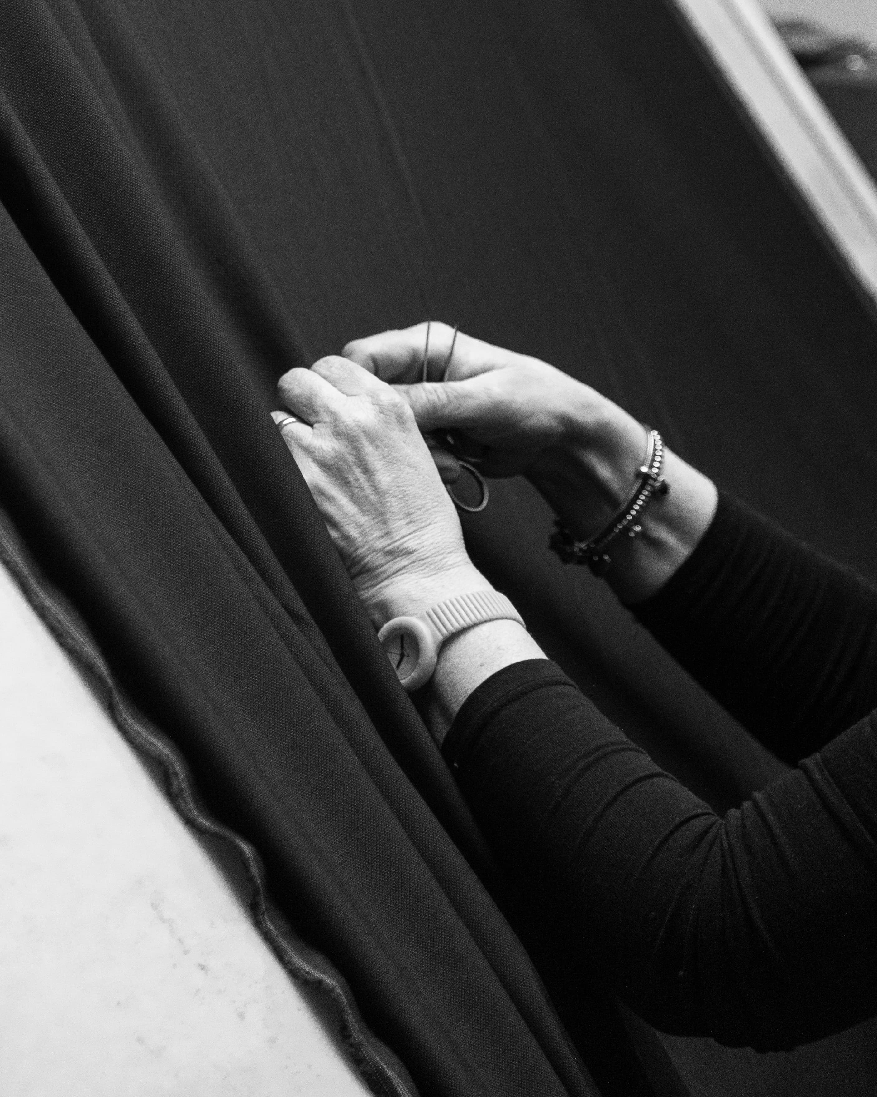 Behind the scenes image of designer working on textile