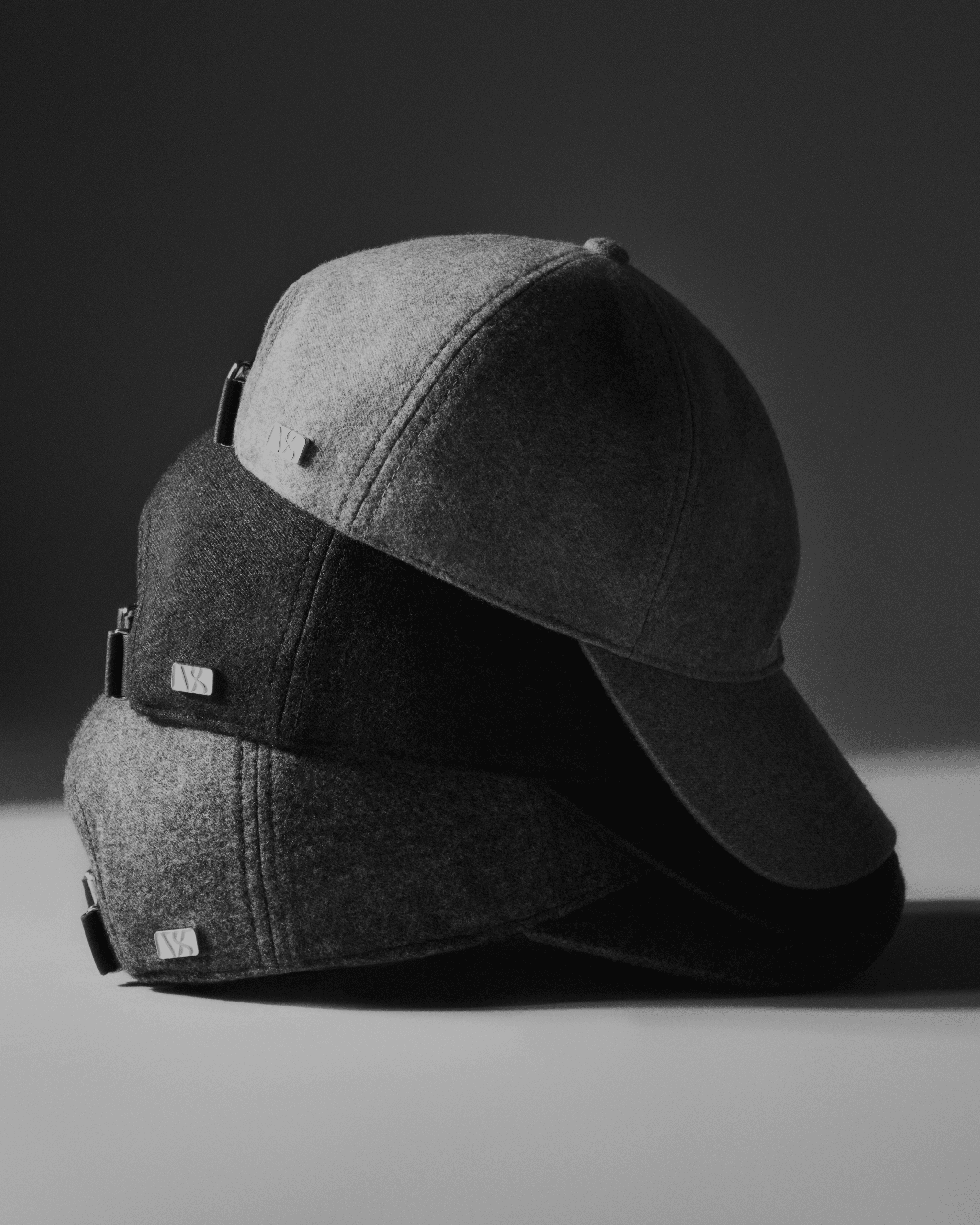 Side view of Loro Piana cashmere caps in three different colors from Varsity Headwear