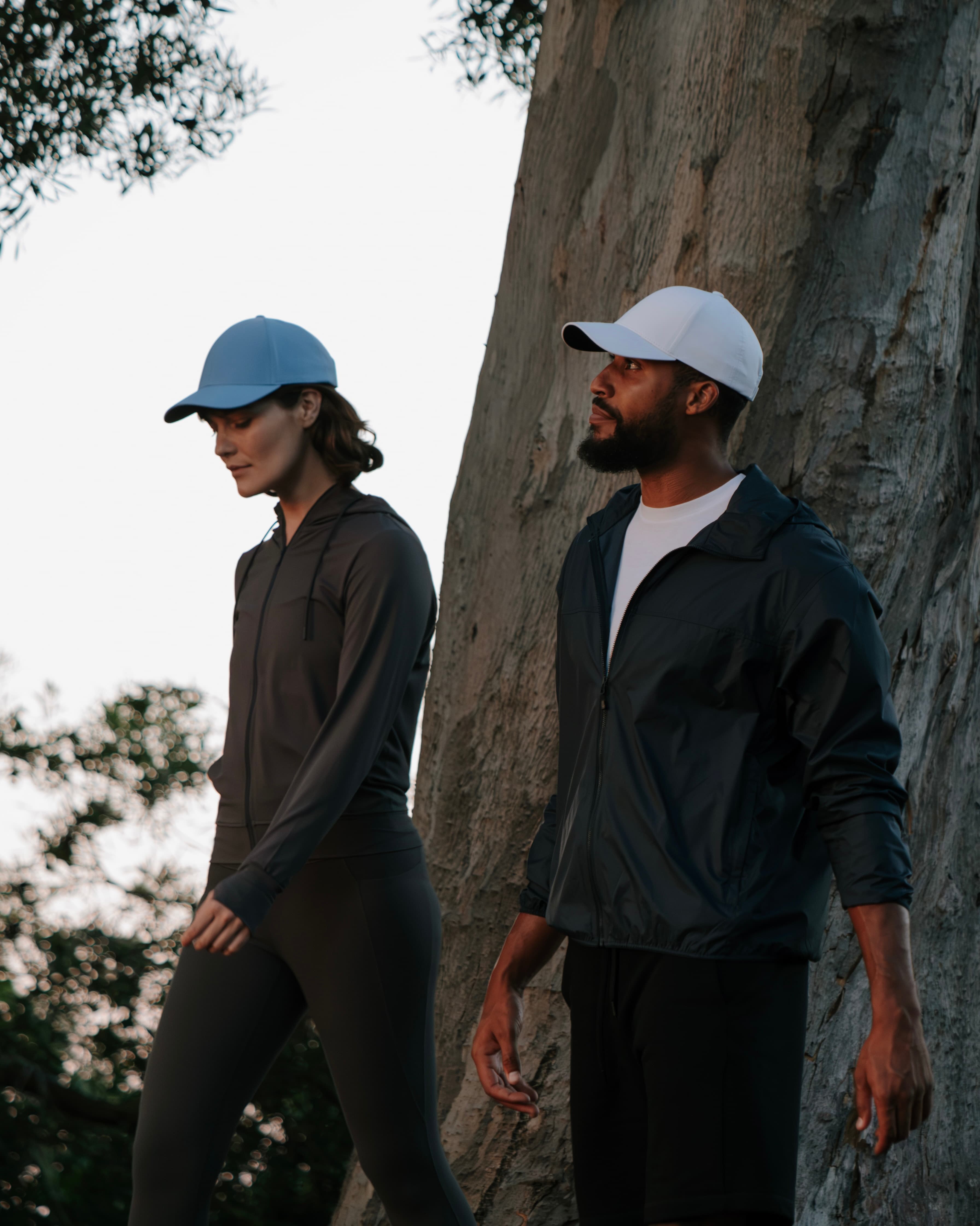 Male and female wearing athletic sport caps while being active