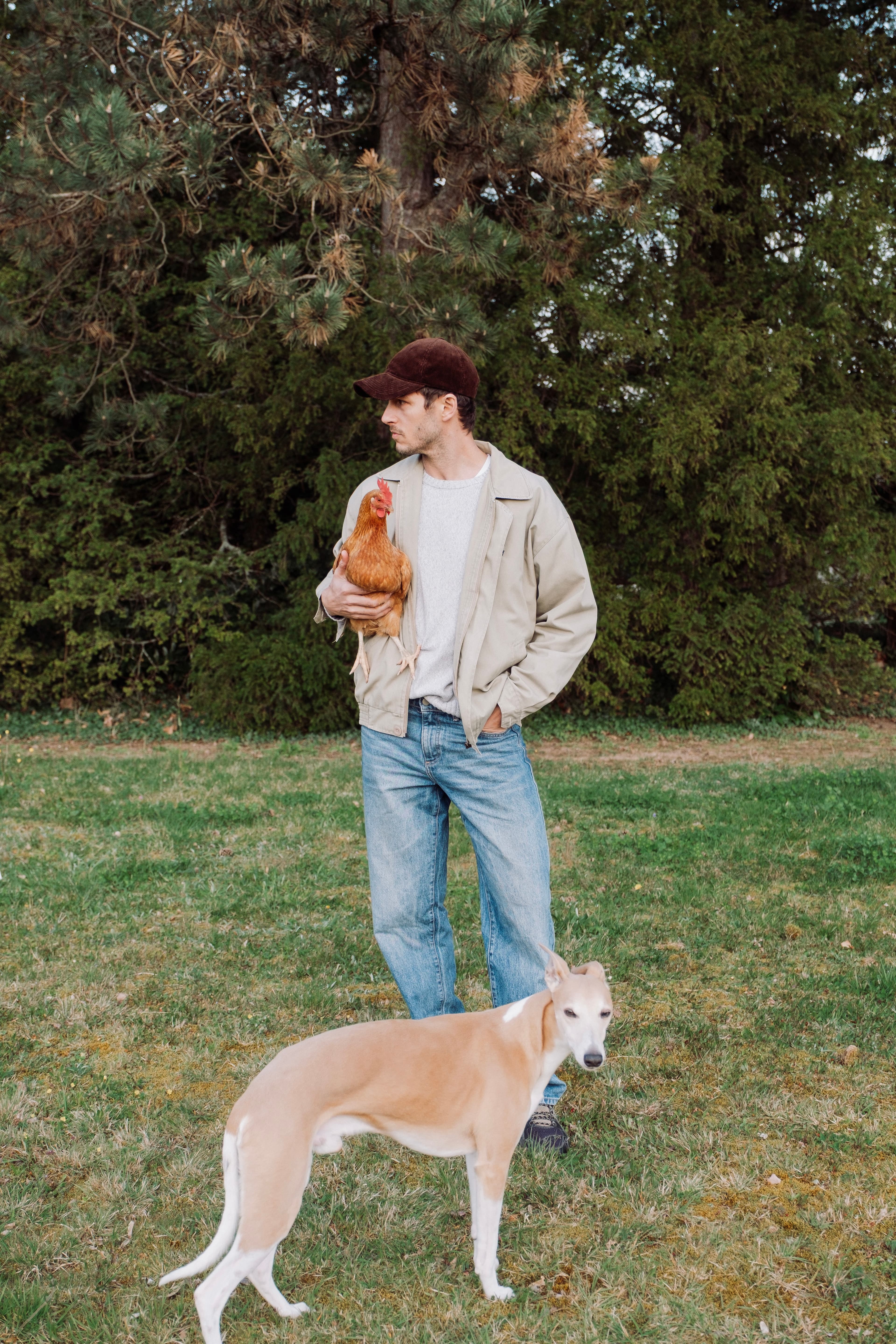 Hedi Sersoub Varsity Headwear ambassador at the country side with his dog and chicken