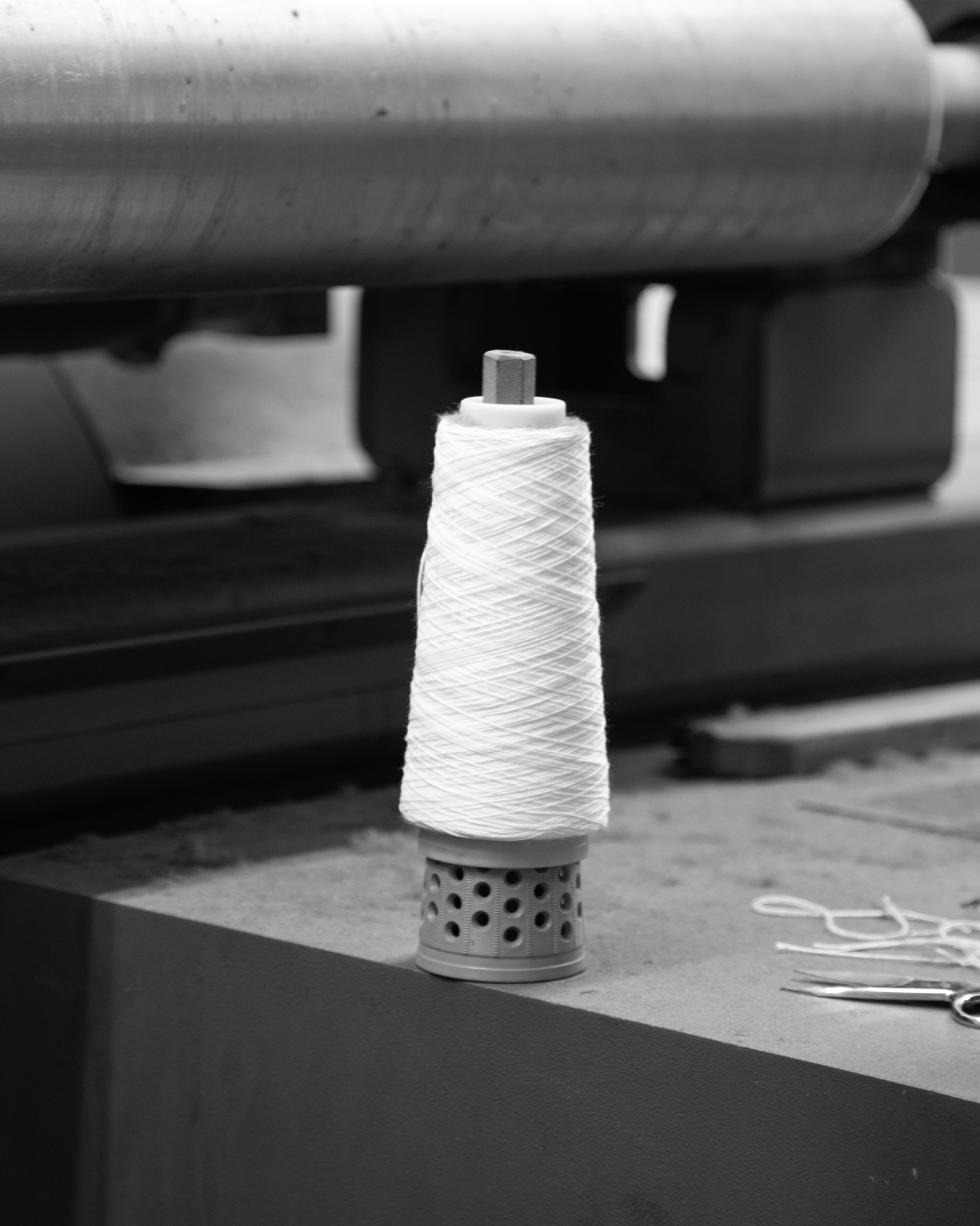 Image of sewing thread at fabric