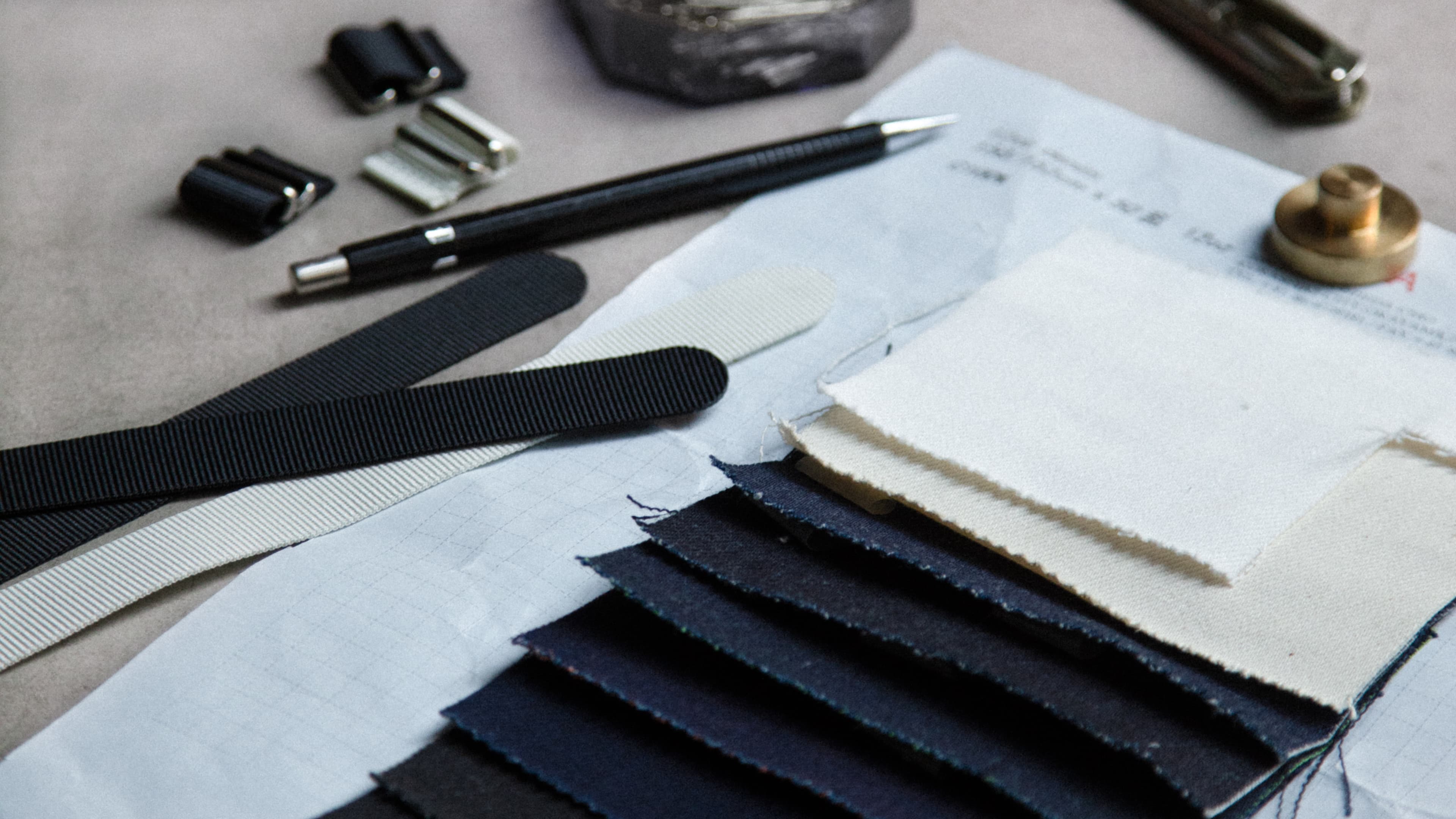 Behind the scenes photo of working with washed denim cap