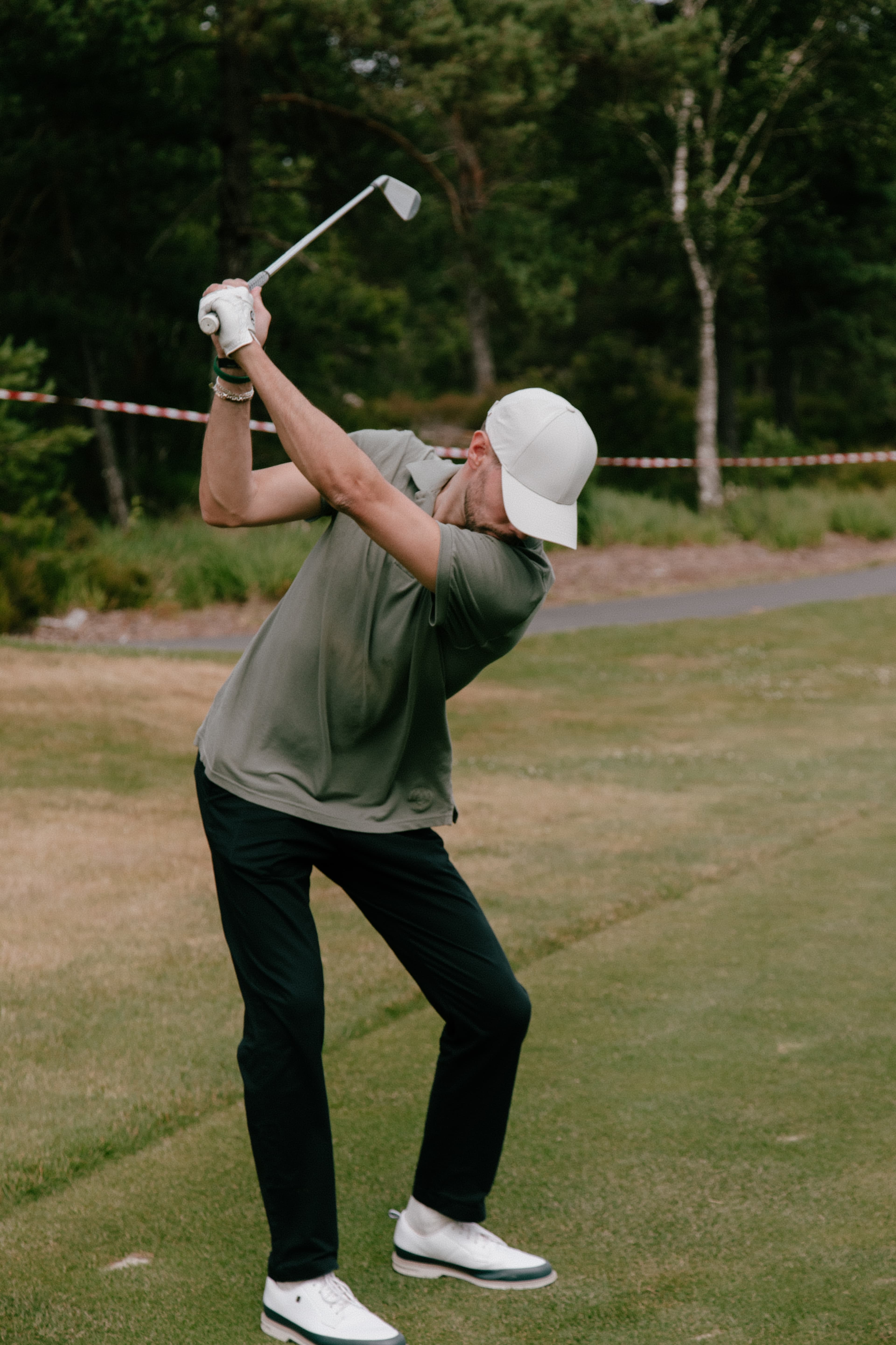 Golf player wearing Varsity Headwear caps while playing golf